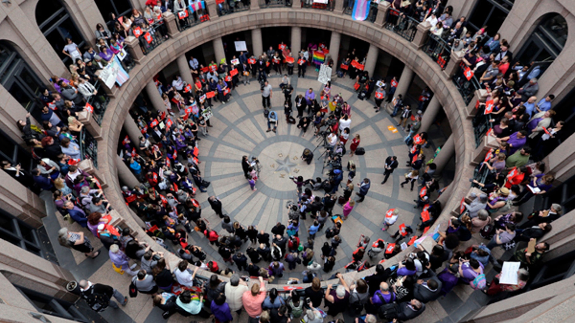 Opponents of a Texas "bathroom bill" protest in the exterior rotunda at the Texas state Capitol in Austin, March 7, 2017.