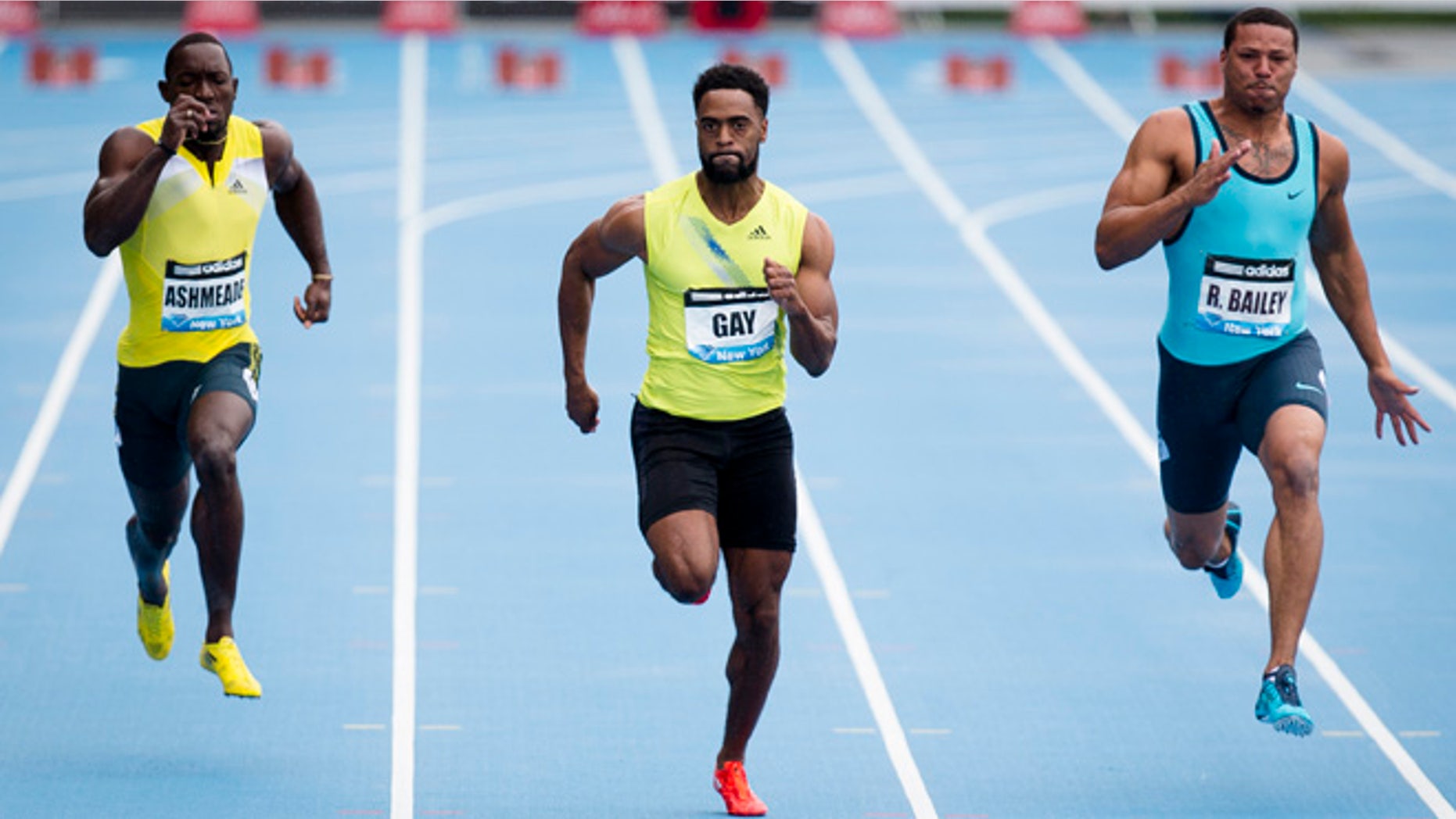 In a May 25, 2013, file photo Tyson Gay, center, competes in the Men's 100m alongside Ryan Bailey, right, and Nickel Ashmeade, of Jamaica, during the IAAF Diamond League Grand Prix competition in New York. Gay was informed Friday July 12, 2013, he has tested positive for a banned substance and says he will pull out of the world championships next month in Moscow.