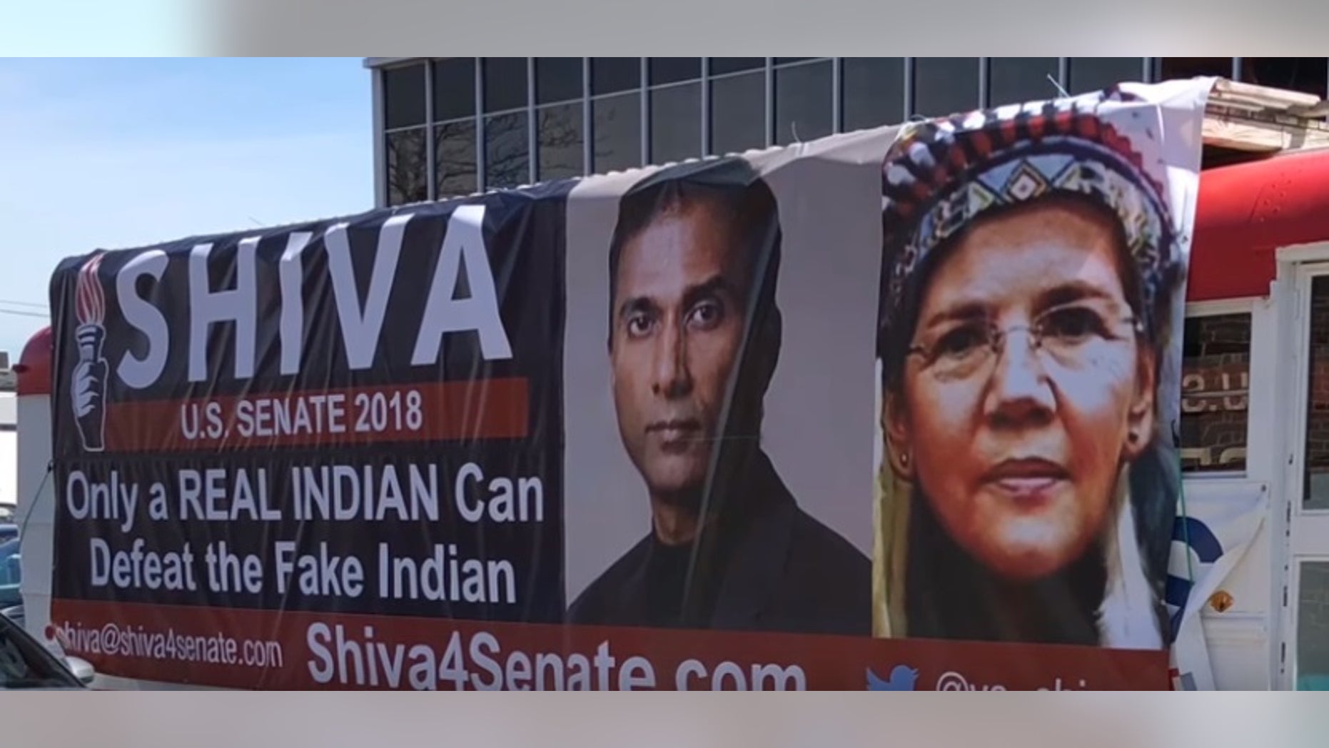 A bus parked outside Shiva Ayyadurai's campaign headquarters taunts Mass. Democratic Sen. Elizabeth Warren's claims of Native American heritage.