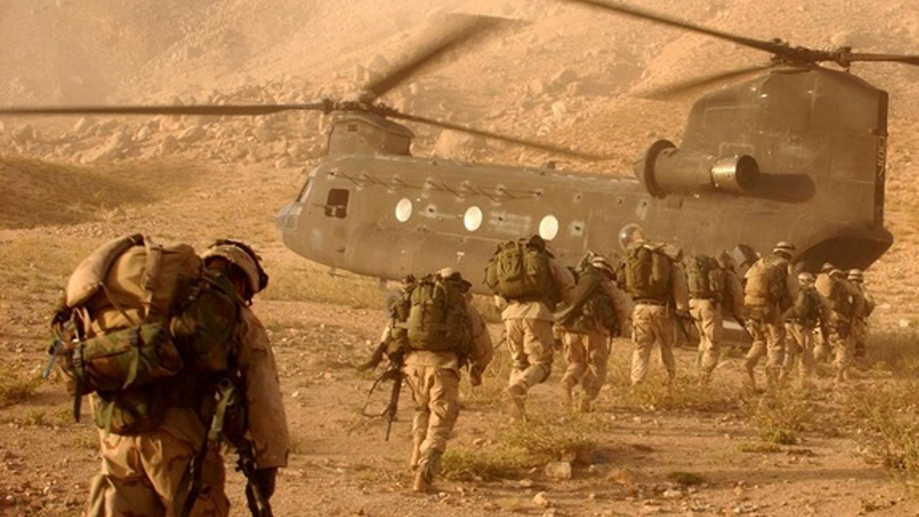 Soliders approach the Chinook helicopter. The researchers' new model could help predict how plasma bubbles could affect future military operations.