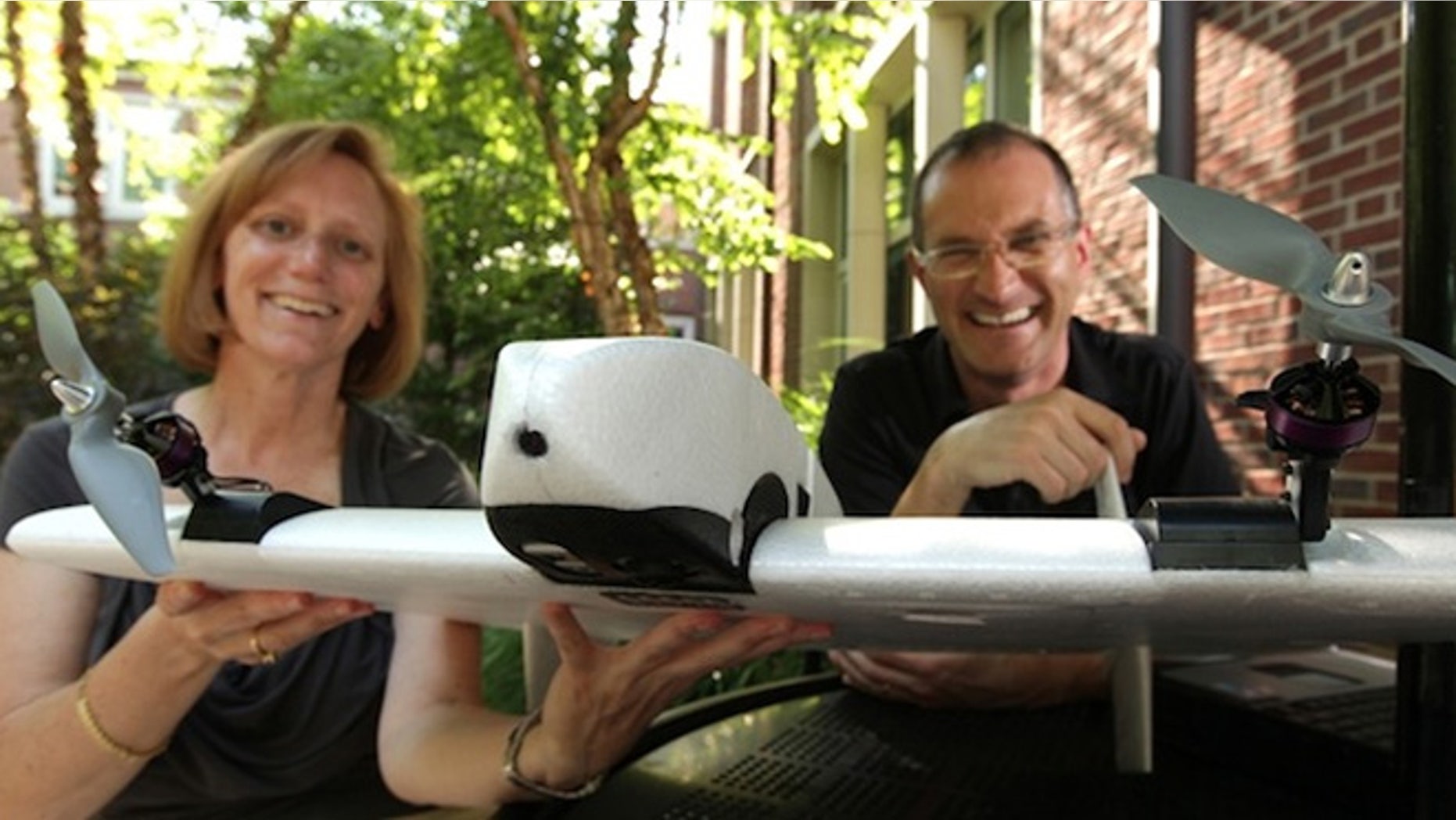 Julie Adams and Steven Wernke with the SUAVe aerial device.