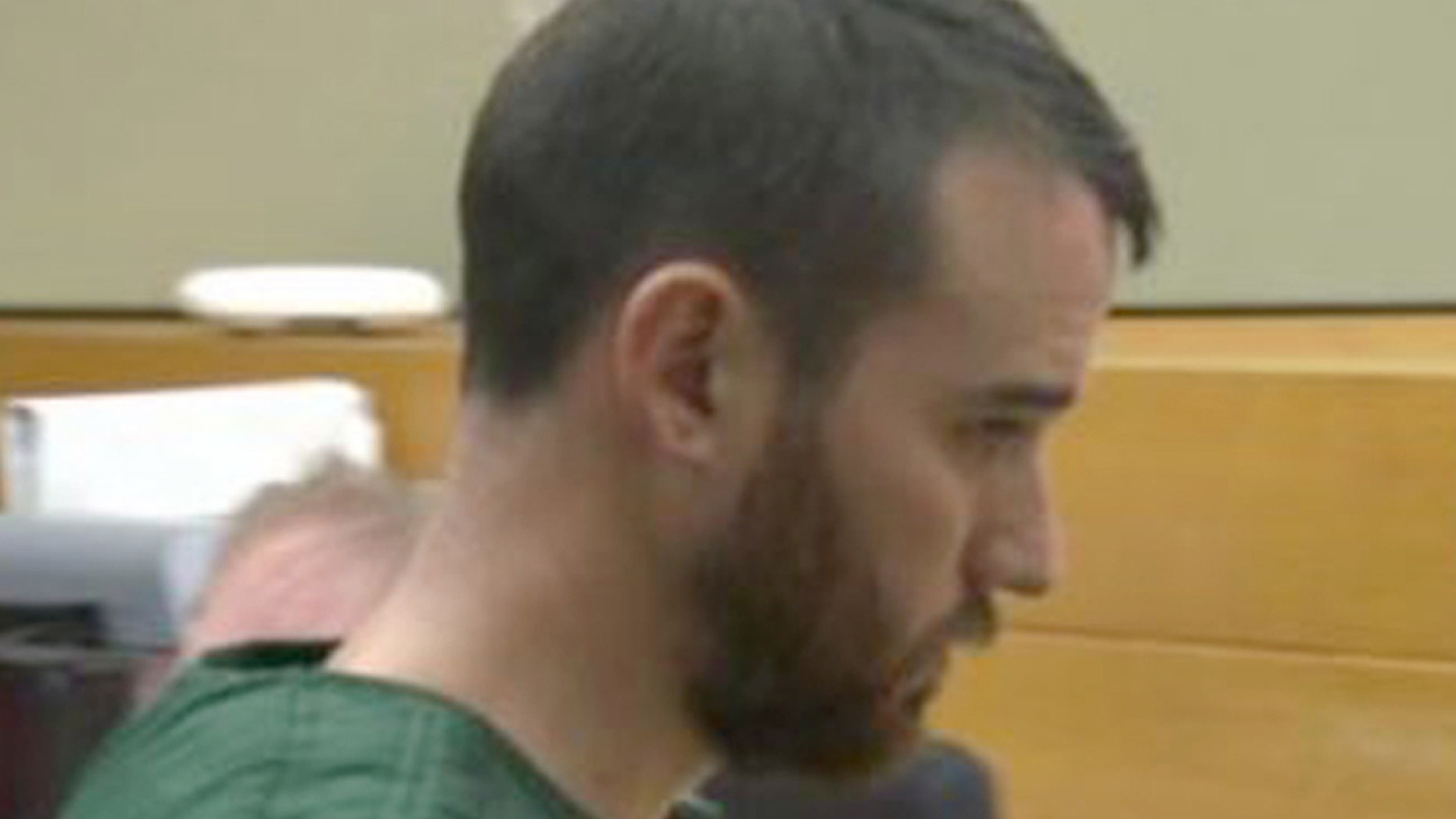 In this image made from a video provided by Q13 News, Cameron Espitia, who is accused of fatally shooting his wife Jennifer Espitia, makes an appearance in a King County courtroom in Seattle, Monday, July 3, 2017.