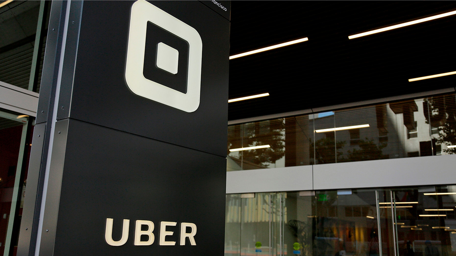 FILE - This June 21, 2017, file photo shows the building that houses the headquarters of Uber, in San Francisco. Uber will start doing annual criminal background checks on U.S. drivers and hire a company that constantly monitors criminal arrests as it tries to do a better job of keeping riders safe, the company announced Thursday, April 12, 2018. (AP Photo/Eric Risberg, File)