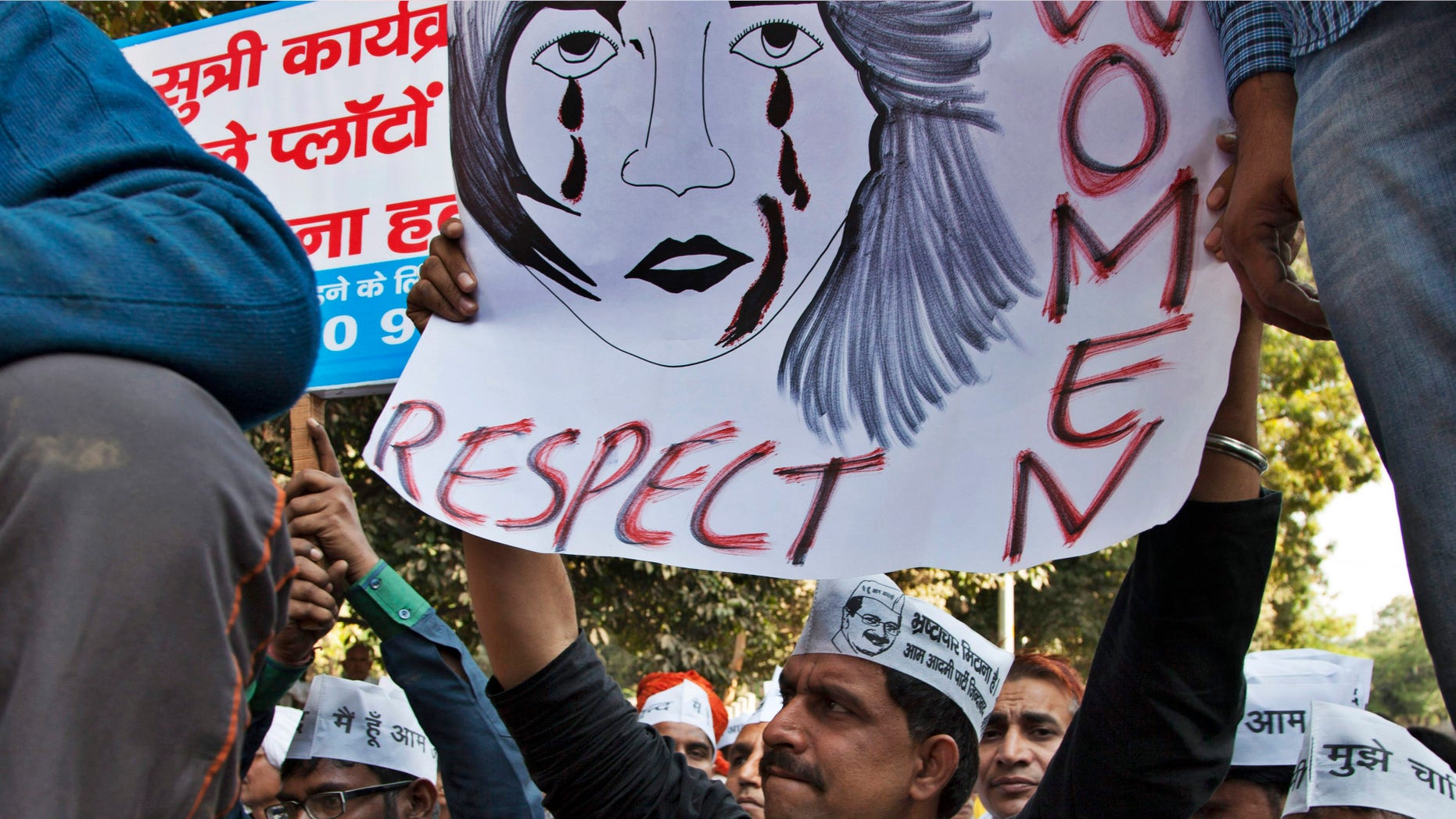Dec. 8, 2014: Supporters of Aam Aadmi (Common Man) Party (AAP) hold placards during a protest after a woman was allegedly raped by a driver from ride-booking service Uber in New Delhi, India.