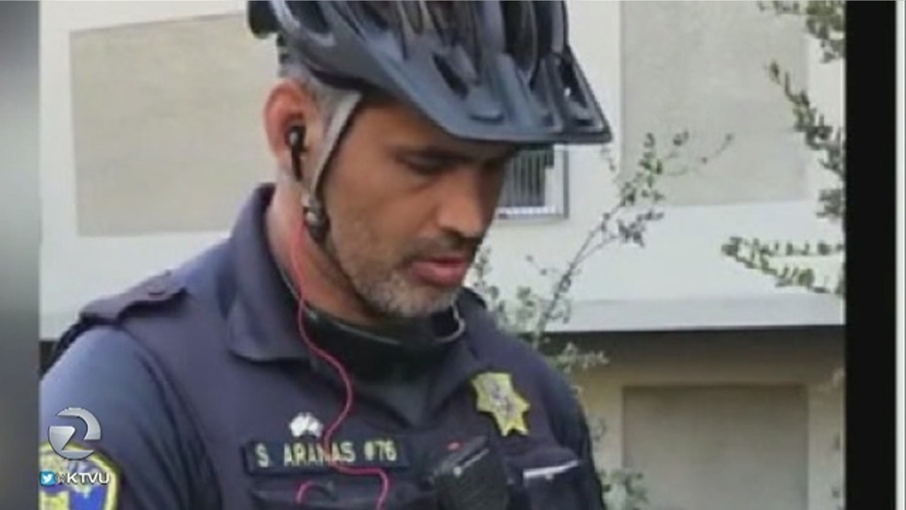 This image taken from video shows the University of California-Berkeley police officer who appeared to confiscate a street vendor's money outside a football game Saturday.
