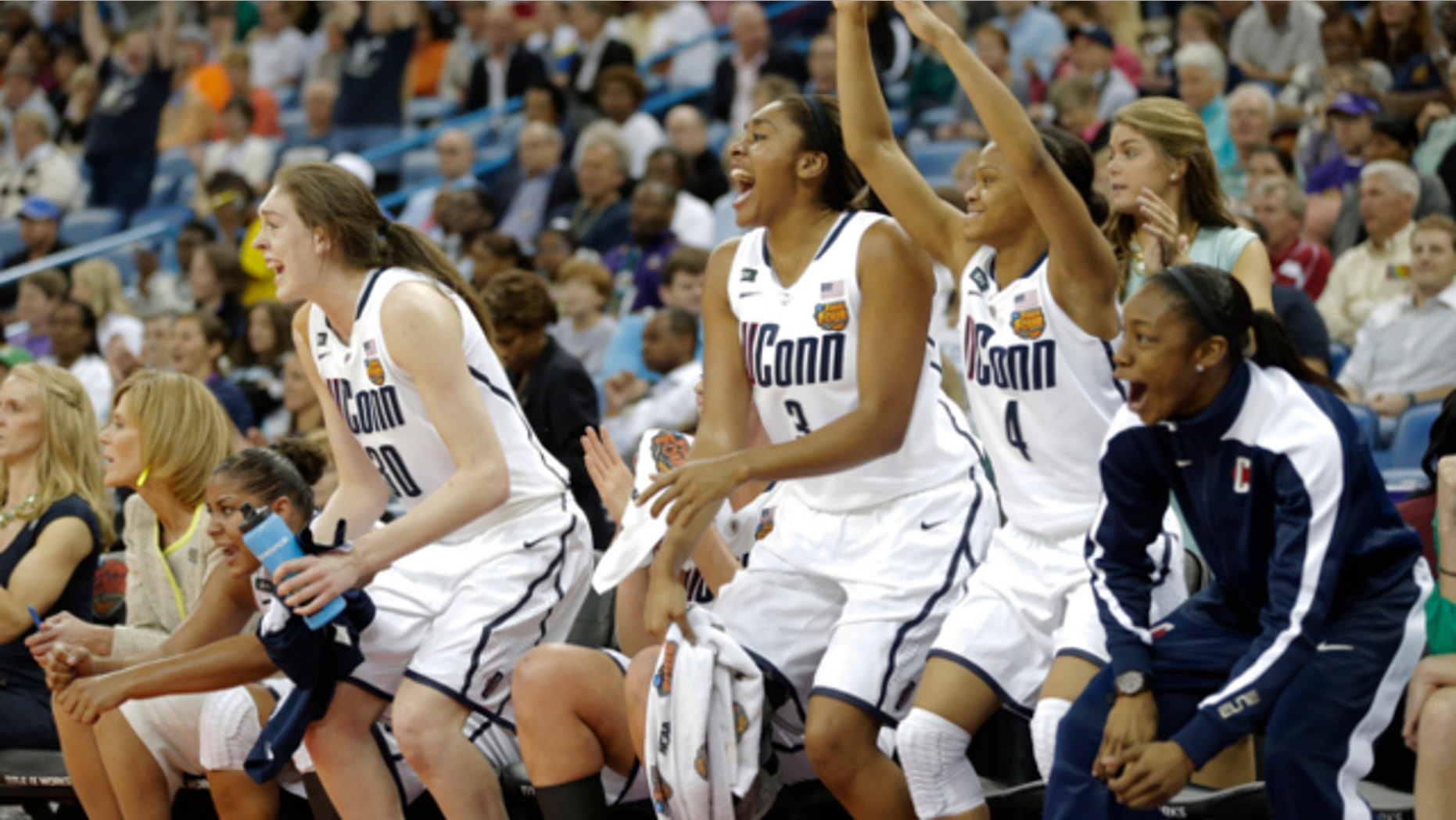April 9, 2013: Connecticut players react against Louisville in the second half of the national championship game of the women's Final Four of the NCAA college basketball tournament in New Orleans.