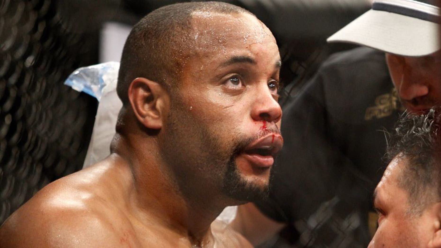 LAS VEGAS, NV - JANUARY 03: Daniel Cormier is treated between rounds as he takes on light heavyweight champion Jon Jones during the UFC 182 event at the MGM Grand Garden Arena on January 3, 2015 in Las Vegas, Nevada. Jones retained his title by unanimous decision. (Photo by Steve Marcus/Getty Images)