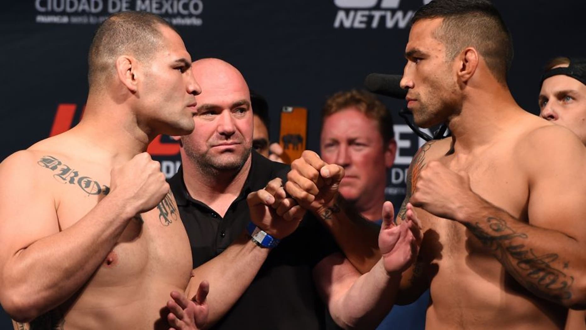 MEXICO CITY, MEXICO - JUNE 12: (L-R) Cain Velasquez of the United States and Fabricio Werdum of Brazil face off during the UFC 188 weigh-in inside the Arena Ciudad de Mexico on June 12, 2015 in Mexico City, Mexico. (Photo by Josh Hedges/Zuffa LLC/Zuffa LLC via Getty Images)