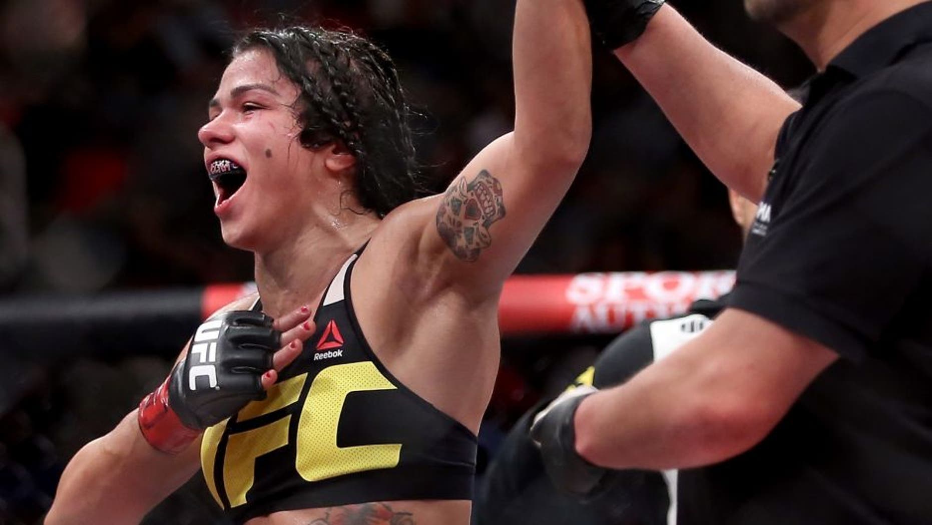 RIO DE JANEIRO, BRAZIL - AUGUST 01: Claudia Gadelha of Brazil celebrates her win overJessica Aguilar of the United States in their strawweight bout during the UFC 190 Rousey v Correia at HSBC Arena on August 1, 2015 in Rio de Janeiro, Brazil. (Photo by Matthew Stockman/Getty Images)