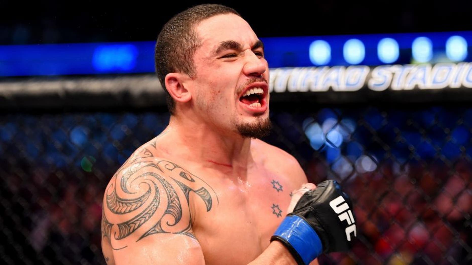 MELBOURNE, AUSTRALIA - NOVEMBER 15: Robert Whittaker celebrates his win by Unanimous Decision against Uriah Hall (not pictured) in their middleweight bout during the UFC 193 event at Etihad Stadium on November 15, 2015 in Melbourne, Australia. (Photo by Josh Hedges/Zuffa LLC/Zuffa LLC via Getty Images)
