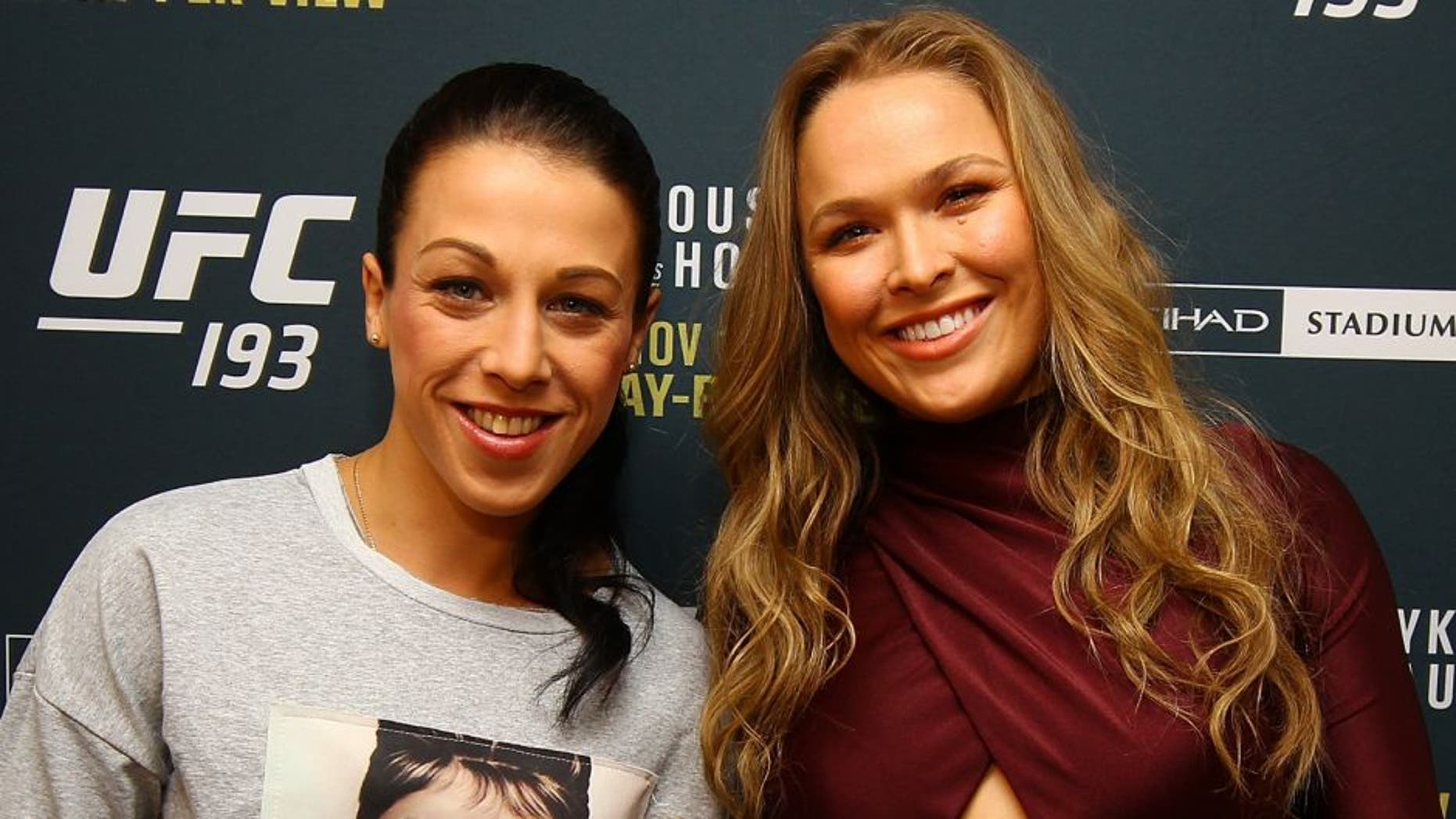 NEW YORK, NY - OCTOBER 06: (R-L) UFC women's bantamweight champion Ronda Rousey and UFC women's strawweight champion Joanna Jedrzejczyk pose for a photo at the London NYC hotel ahead of UFC 193 on October 6, 2015 in New York, United States. (Photo by Mike Stobe/Zuffa LLC/Zuffa LLC via Getty Images)
