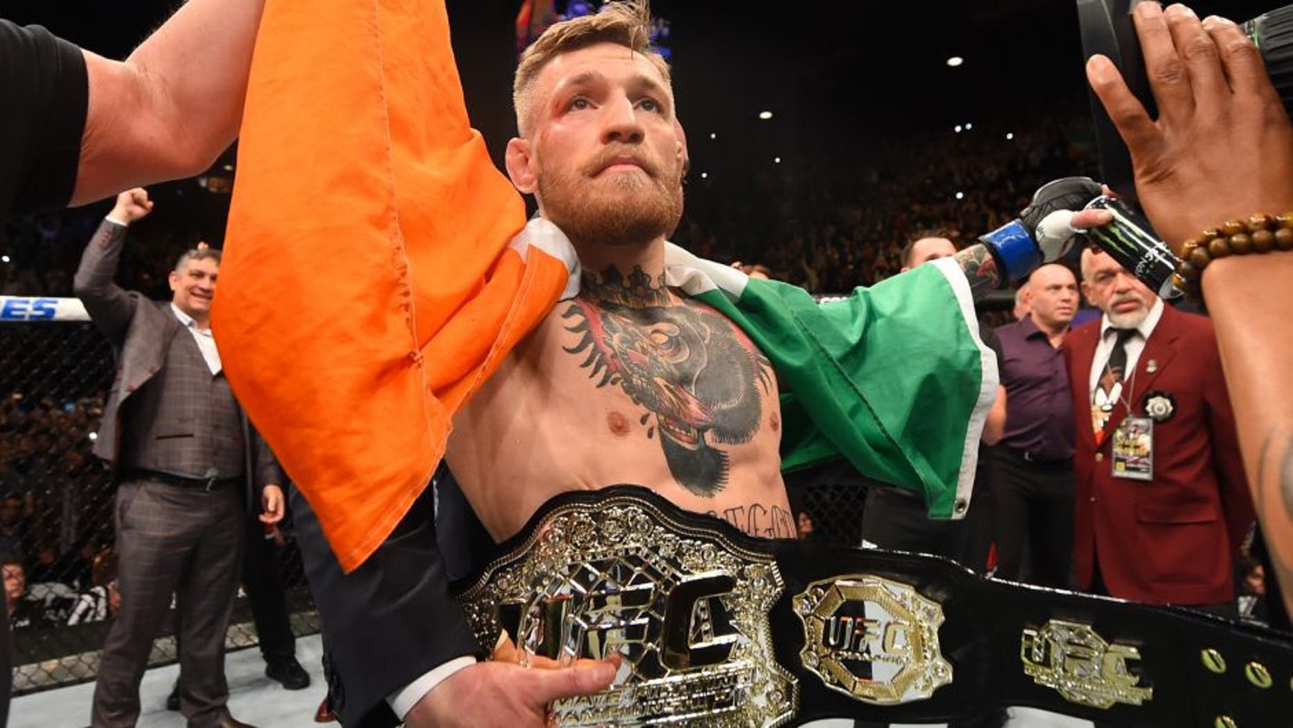 LAS VEGAS, NV - DECEMBER 12: Conor McGregor of Ireland reacts to his victory over Jose Aldo of Brazil in their UFC featherweight championship bout during the UFC 194 event inside MGM Grand Garden Arena on December 12, 2015 in Las Vegas, Nevada. (Photo by Josh Hedges/Zuffa LLC/Zuffa LLC via Getty Images)