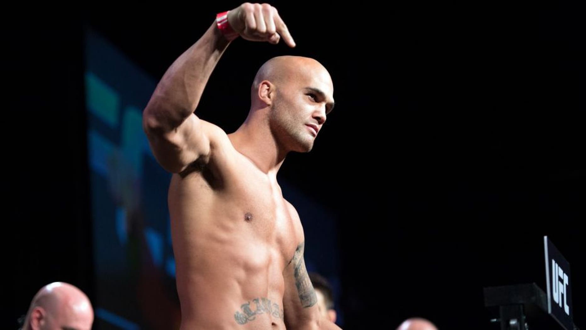 LAS VEGAS, NEVADA - JANUARY 01: UFC welterweight champion Robbie Lawler steps on the scale during the UFC 195 weigh-in at the MGM Grand Conference Center on January 1, 2016 in Las Vegas, Nevada. (Photo by Jeff Bottari/Zuffa LLC/Zuffa LLC via Getty Images)