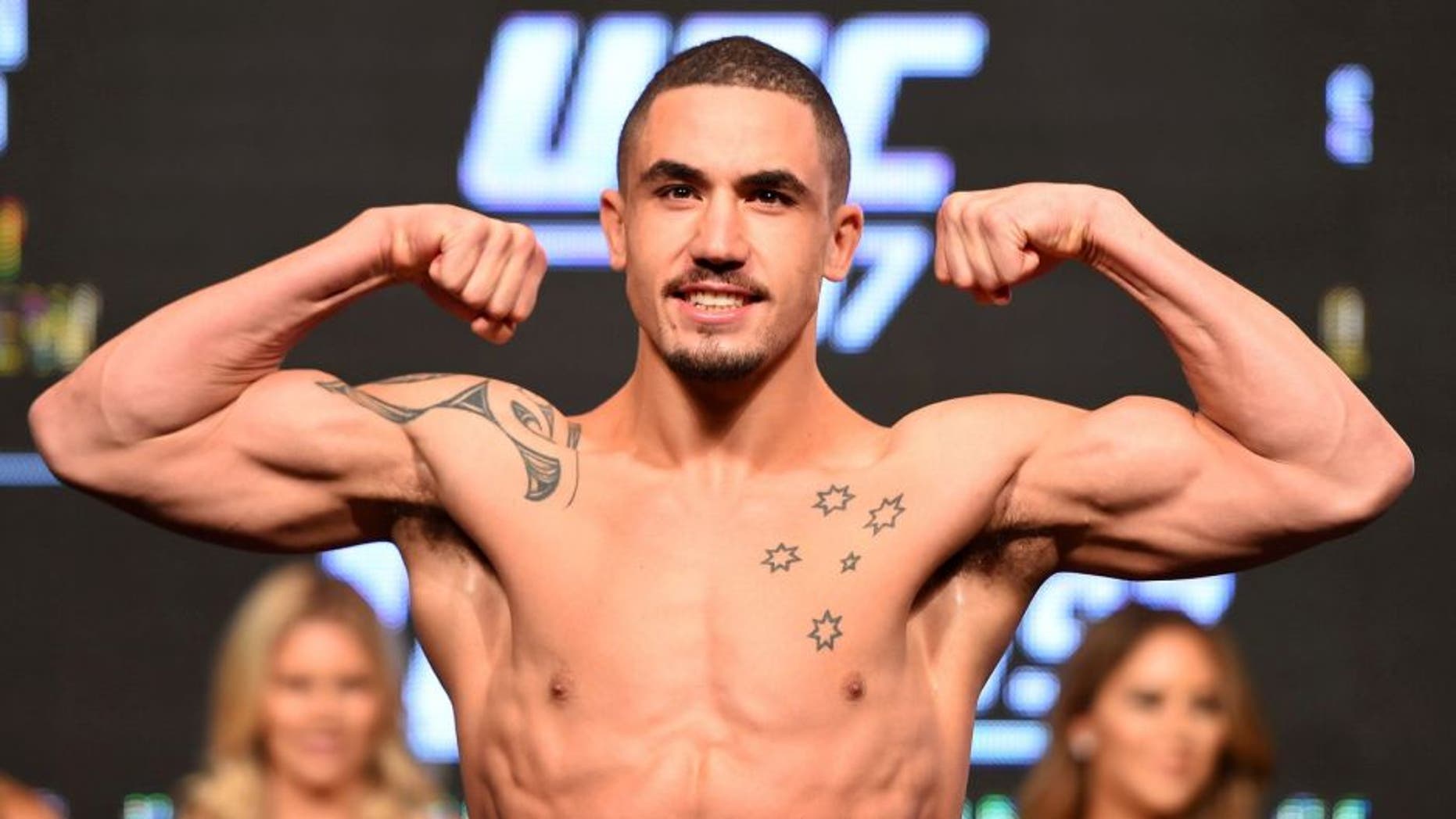LAS VEGAS, NV - APRIL 20: Robert Whittaker of New Zealand steps on the scale during the UFC 197 weigh-in at the MGM Grand Garden Arena on April 20, 2016 in Las Vegas, Nevada. (Photo by Josh Hedges/Zuffa LLC/Zuffa LLC via Getty Images)