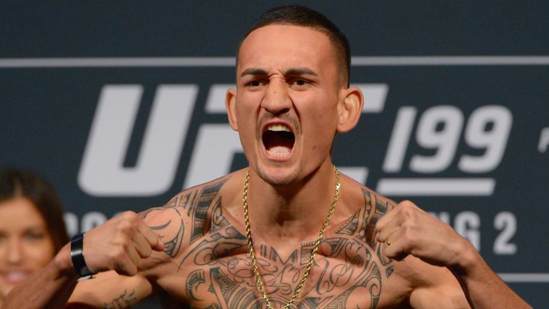 INGLEWOOD, CA - JUNE 03: Max Holloway stands on the scale during the weigh-in for UFC 199 at The Forum on June 1, 2016 in Inglewood, California. (Photo by Jayne Kamin-Oncea/Getty Images)