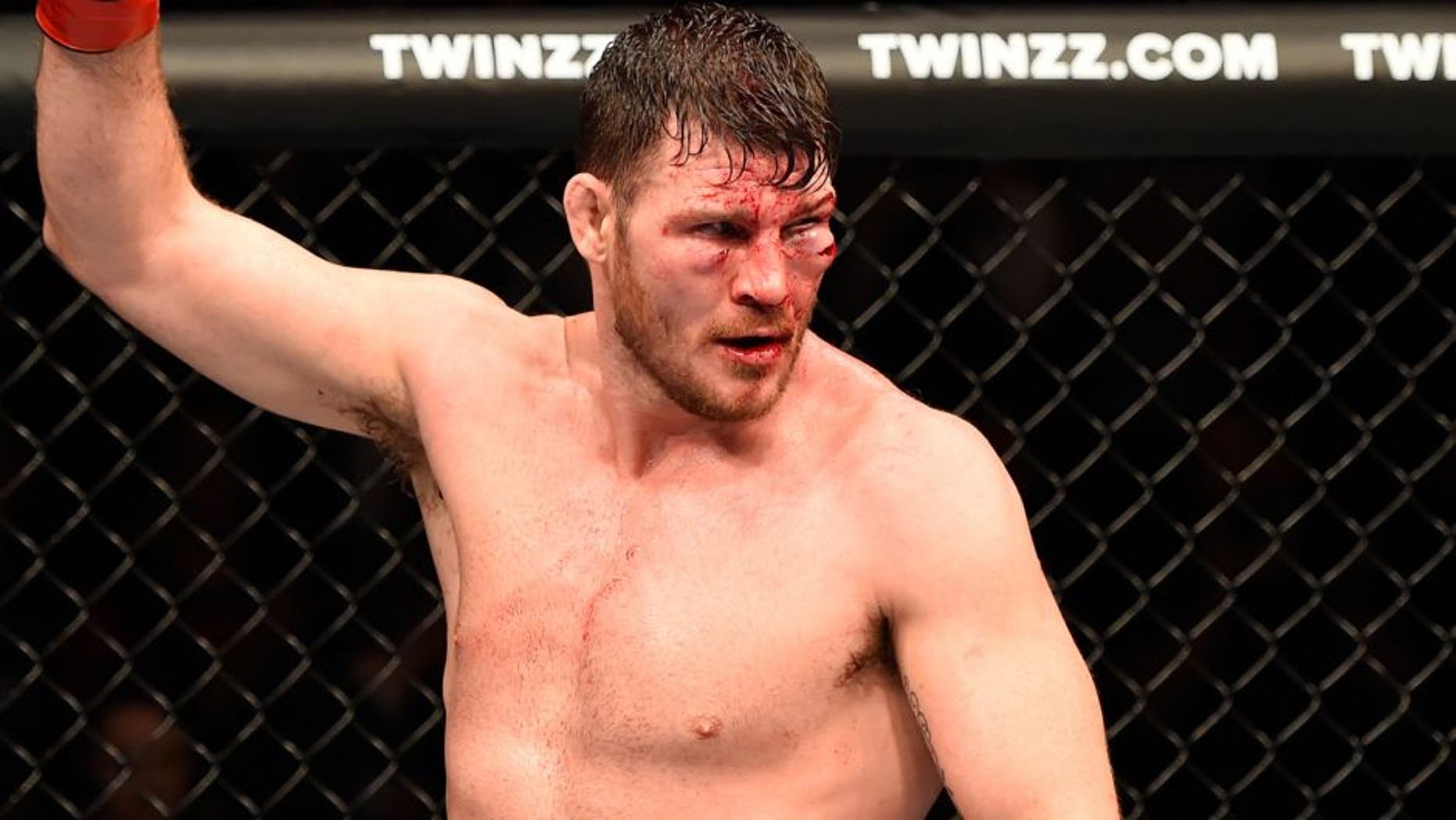 MANCHESTER, ENGLAND - OCTOBER 08: Michael Bisping of England raises his hand after facing Dan Henderson in their UFC middleweight championship bout during the UFC 204 Fight Night at the Manchester Evening News Arena on October 8, 2016 in Manchester, England. (Photo by Josh Hedges/Zuffa LLC/Zuffa LLC via Getty Images)