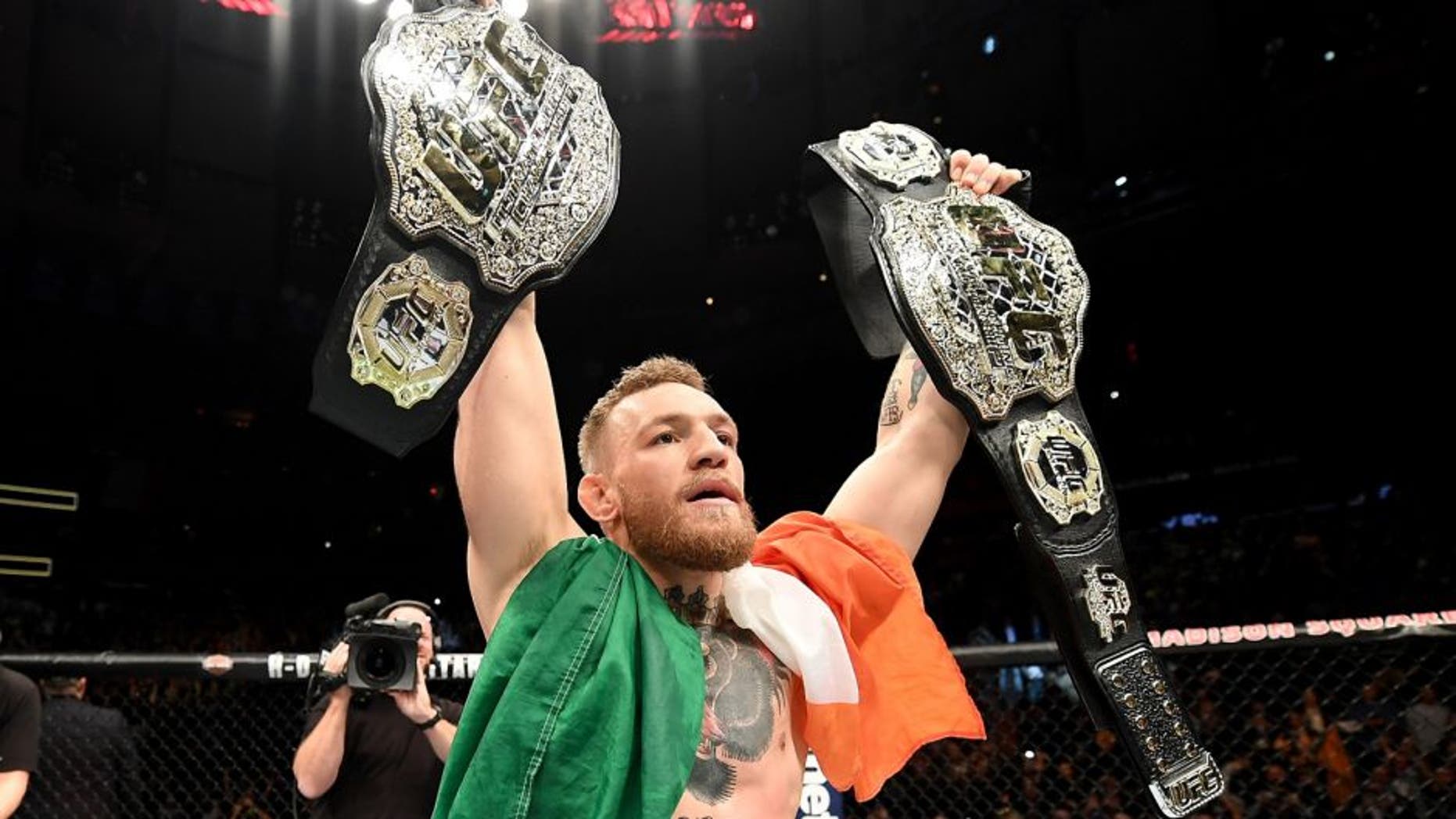 NEW YORK, NY - NOVEMBER 12: Conor McGregor of Ireland celebrates his KO victory over Eddie Alvarez of the United States in their lightweight championship bout during the UFC 205 event at Madison Square Garden on November 12, 2016 in New York City. (Photo by Jeff Bottari/Zuffa LLC/Zuffa LLC via Getty Images)