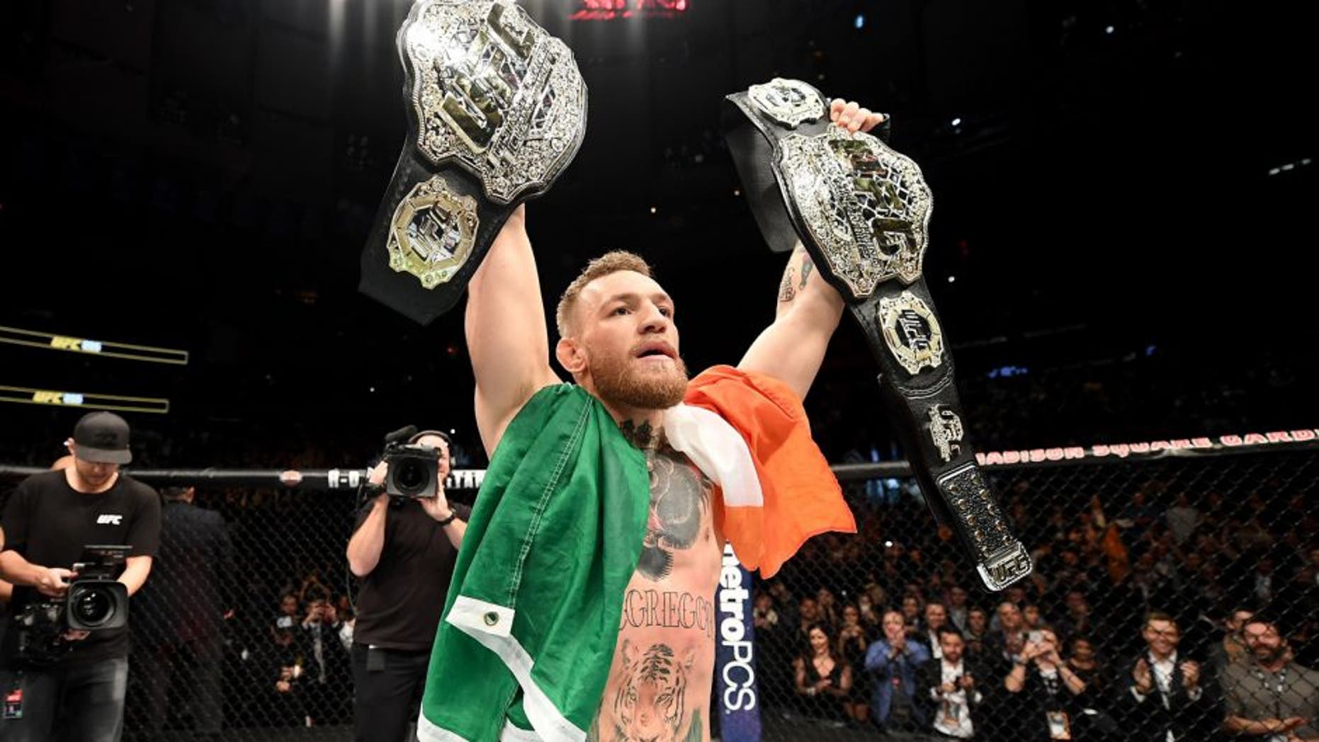 NEW YORK, NY - NOVEMBER 12: Conor McGregor of Ireland celebrates his KO victory over Eddie Alvarez of the United States in their lightweight championship bout during the UFC 205 event at Madison Square Garden on November 12, 2016 in New York City. (Photo by Jeff Bottari/Zuffa LLC/Zuffa LLC via Getty Images)