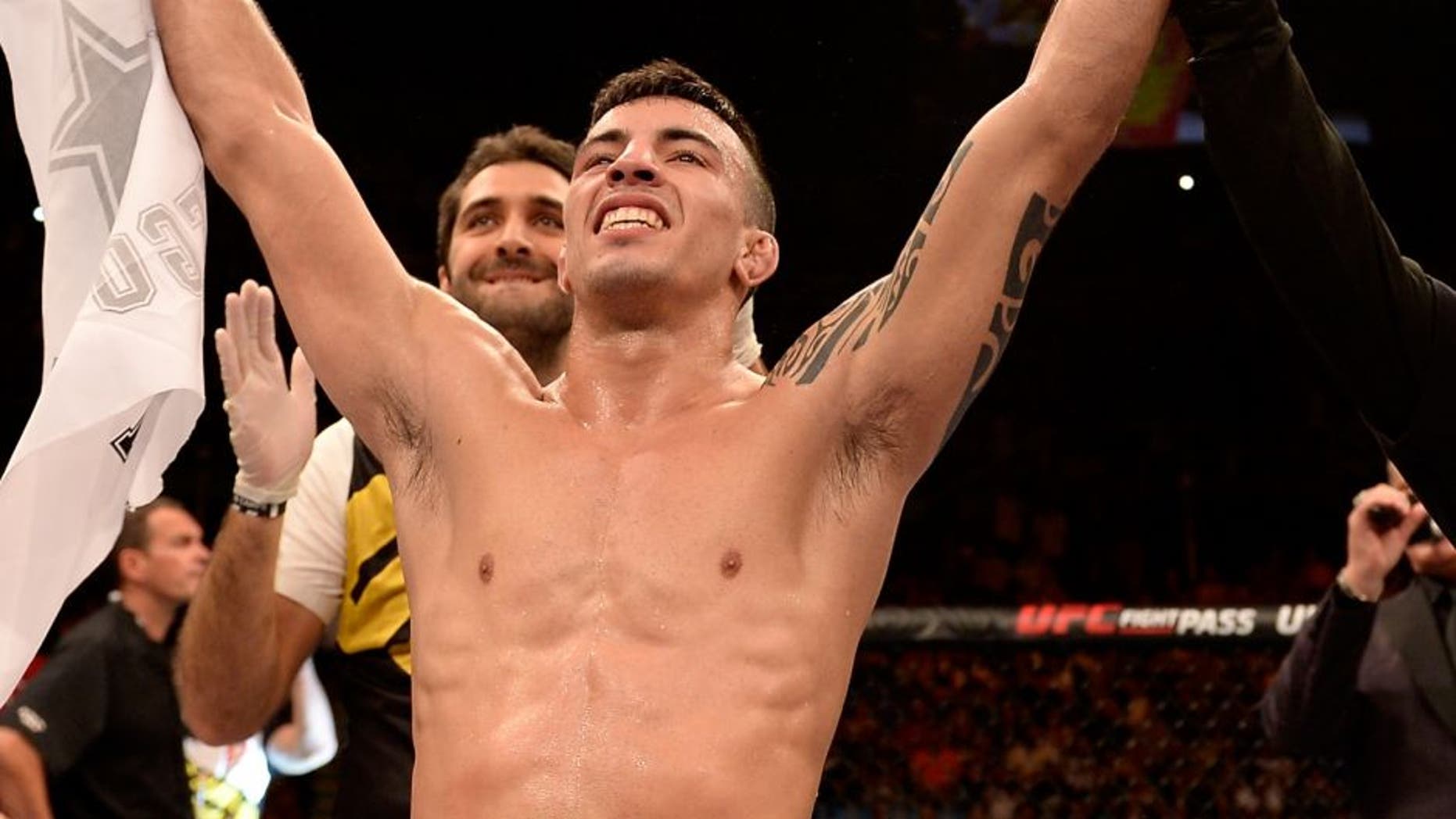 SAO PAULO, BRAZIL - NOVEMBER 07: Thomas Almeida of Brazil celebrates victory over Anthony Birchak of the United States in their bantamweight bout during the UFC Fight Night Belfort v Henderson at Ibirapuera Gymnasium on November 7, 2015 in Sao Paulo, Brazil. (Photo by Buda Mendes/Zuffa LLC/Zuffa LLC via Getty Images)