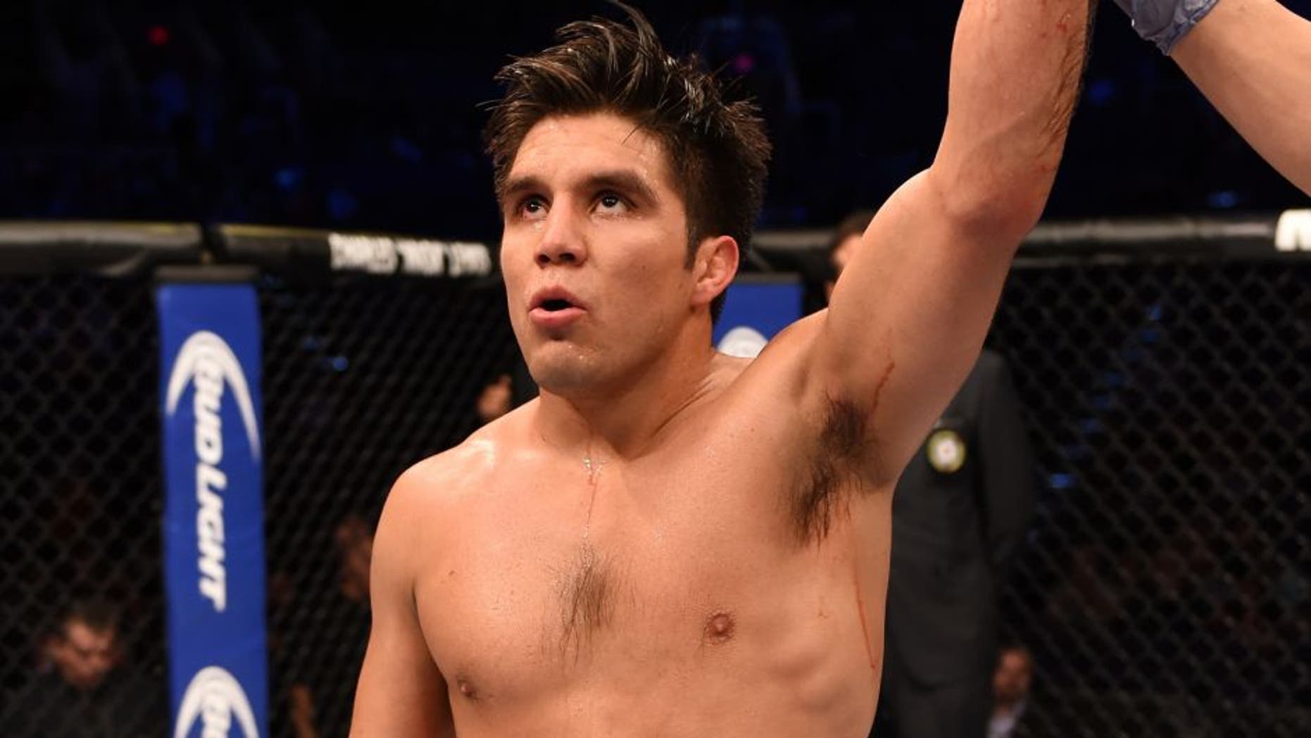 PHOENIX, AZ - DECEMBER 13: Henry Cejudo celebrates after defeating Dusitn Kimura in their bantamweight fight during the UFC Fight Night event at the U.S. Airways Center on December 13, 2014 in Phoenix, Arizona. (Photo by Josh Hedges/Zuffa LLC/Zuffa LLC via Getty Images)