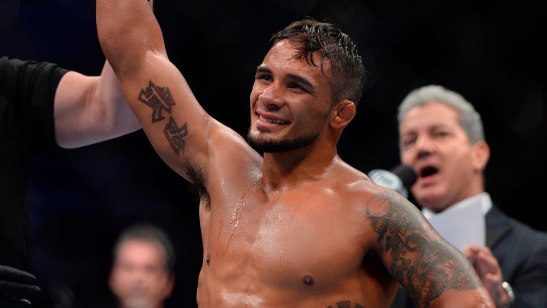 SAN JOSE, CA - JULY 26: Dennis Bermudez celebrates after submitting Clay Guida in their featherweight bout during the UFC Fight Night event at the SAP Center on July 26, 2014 in San Jose, California. (Photo by Jeff Bottari/Zuffa LLC/Zuffa LLC via Getty Images)