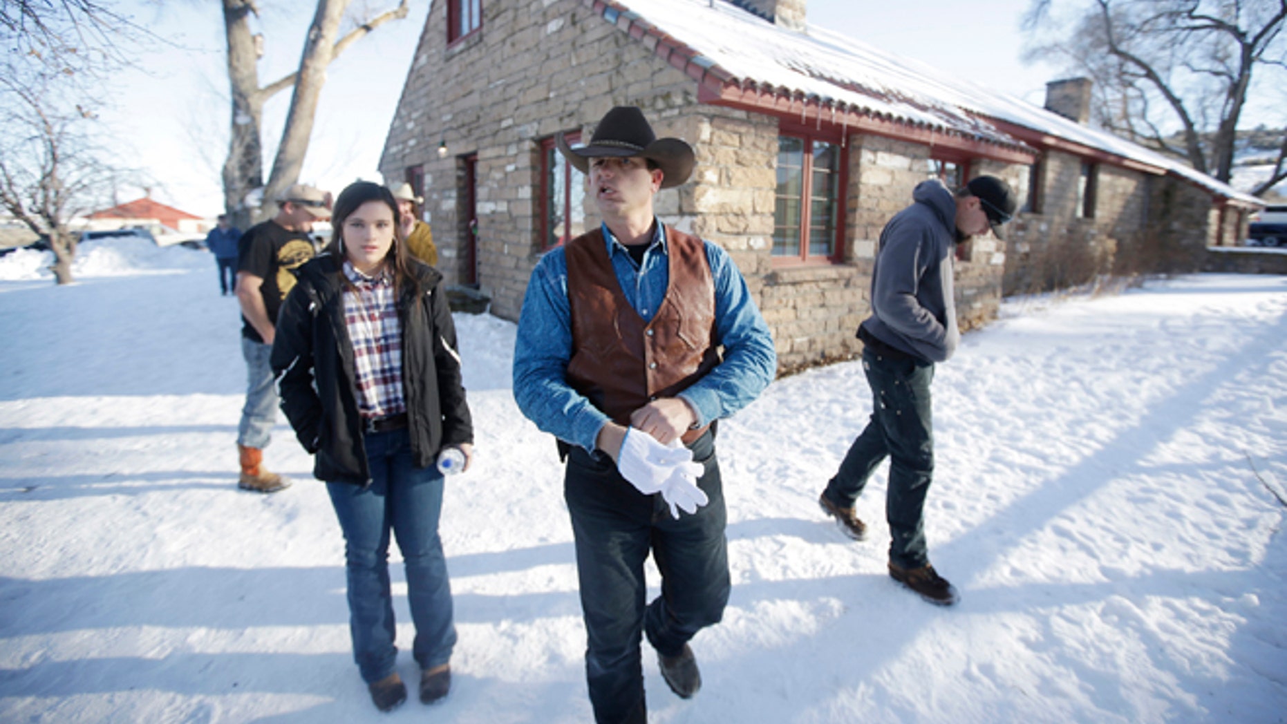 JANUARY 2016: Ryan Bundy, center, one of the sons of Nevada rancher Cliven Bundy, walks through the Malheur National Wildlife Refuge near Burns, Ore. I