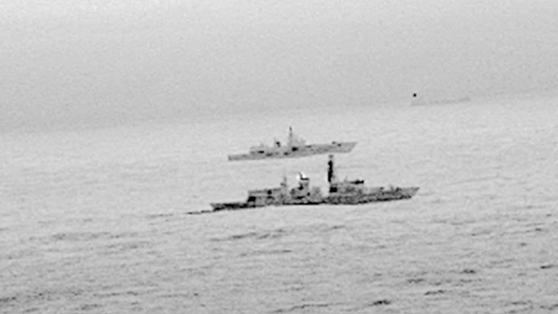 The Royal Navy's HMS St Albans escorts a Russian warship through the North Sea and areas of U.K. interest on Christmas Day, Monday, Dec. 25, 2017.