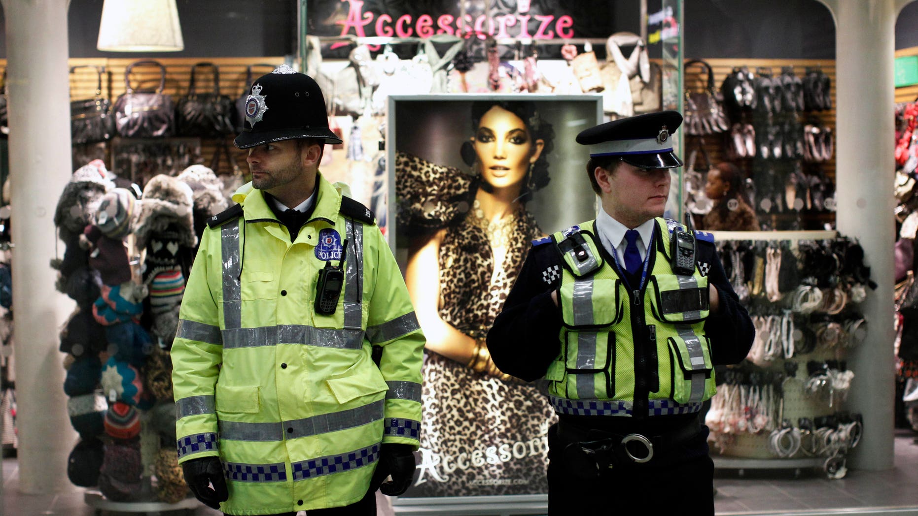 Jan. 7, 2011: A police officer, left, and a community support officer patrol St Pancras International train station in London. More police officers were being deployed at transport hubs in London amid continuing fears of a terrorist attack, British media reported Thursday. Sky News reported that transport police were told to cancel days off Friday, and that there would be a heavy police presence across the capital, including near Luton and Heathrow airports. (AP)