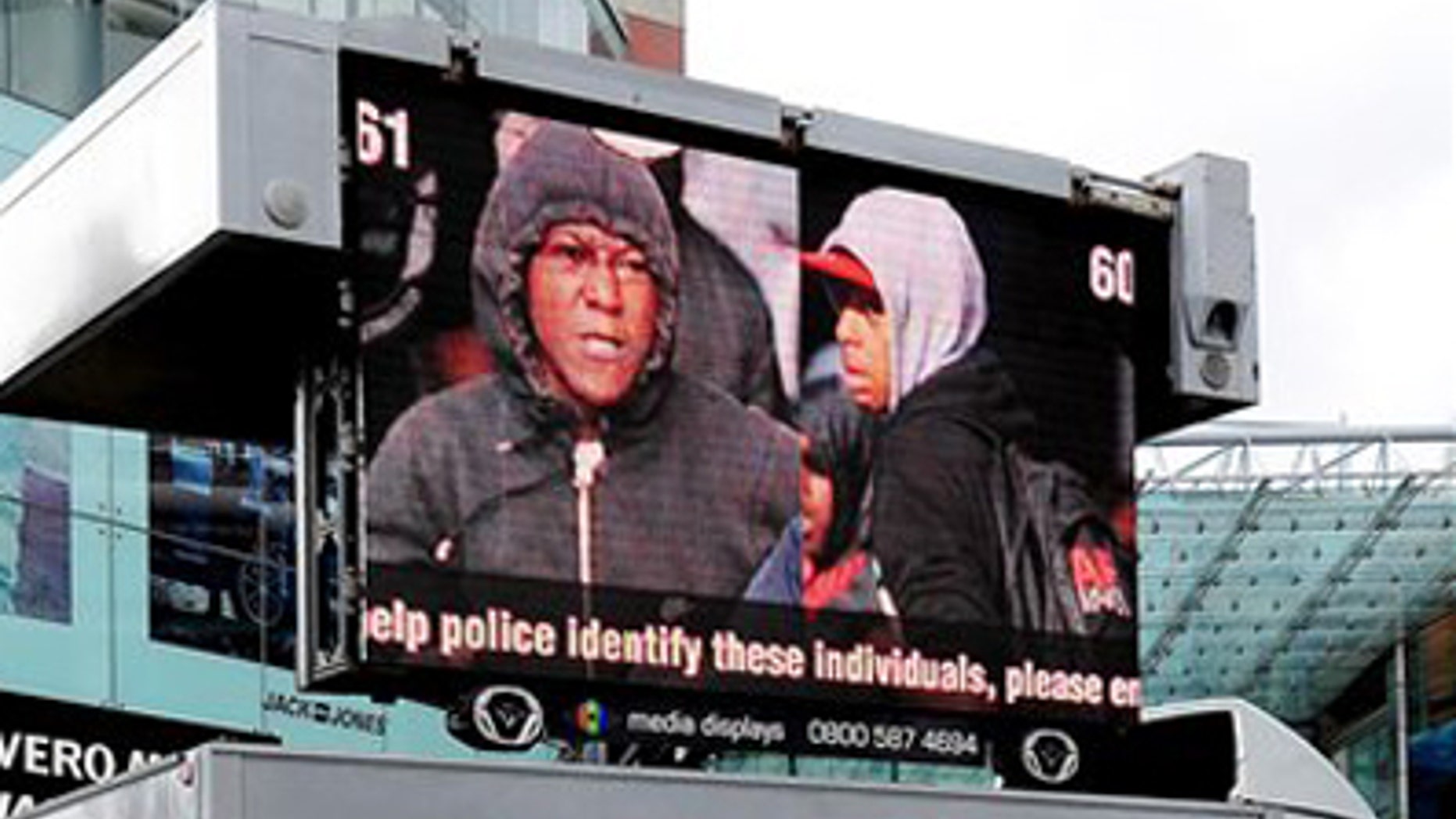 West Midlands Police appeal to the public by displaying pictures of suspected rioters outside the Bull Ring shopping centre in Birmingham England Friday Aug. 12, 2011.