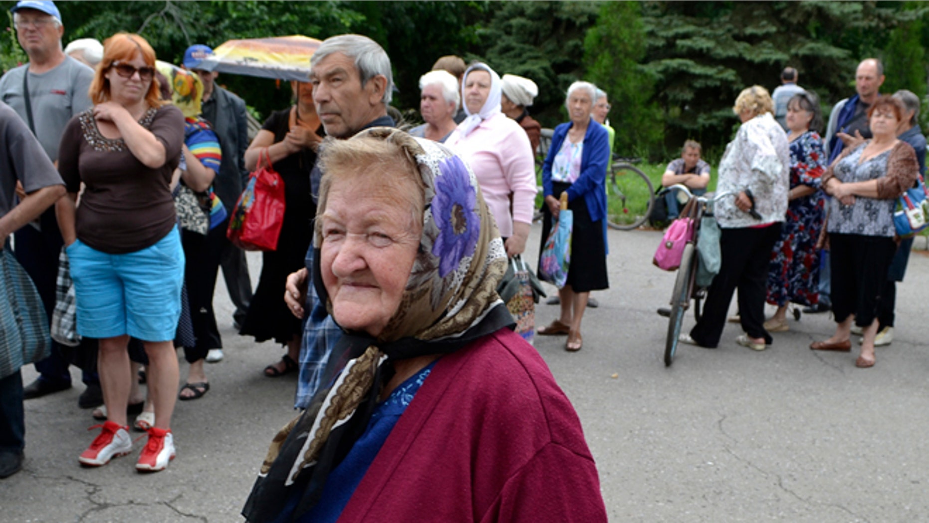 June 23, 2014: Local citizens lineup to get free food in besieged Slovyansk, eastern Ukraine. Insurgents promised Monday to honor a cease-fire declared by the Ukrainian president and engage in more talks to help resolve the conflict that has left hundreds dead in eastern Ukraine.