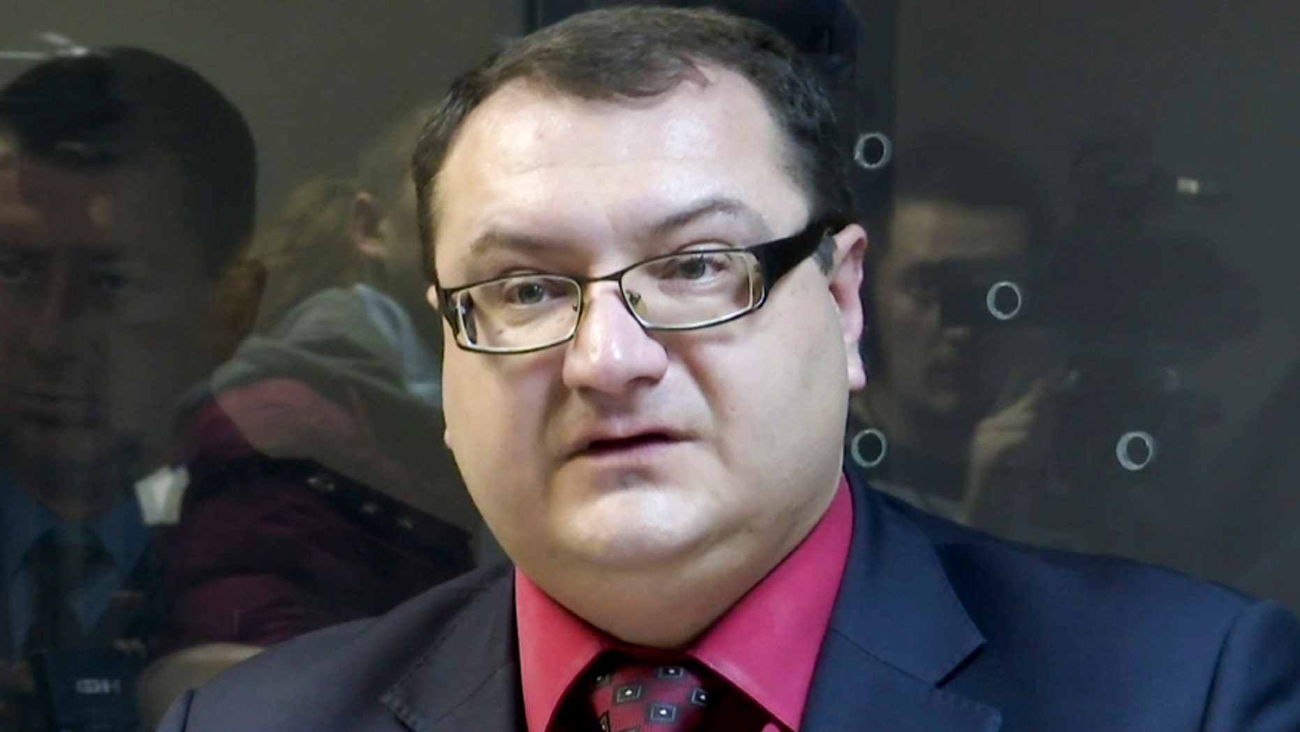 In this grab taken from Associated Press Television footage on Tuesday, Nov. 3, 2015, Yuri Grabovsky speaks during a trial hearing at the Holosiivskyi District Court in Kiev, Ukraine.
