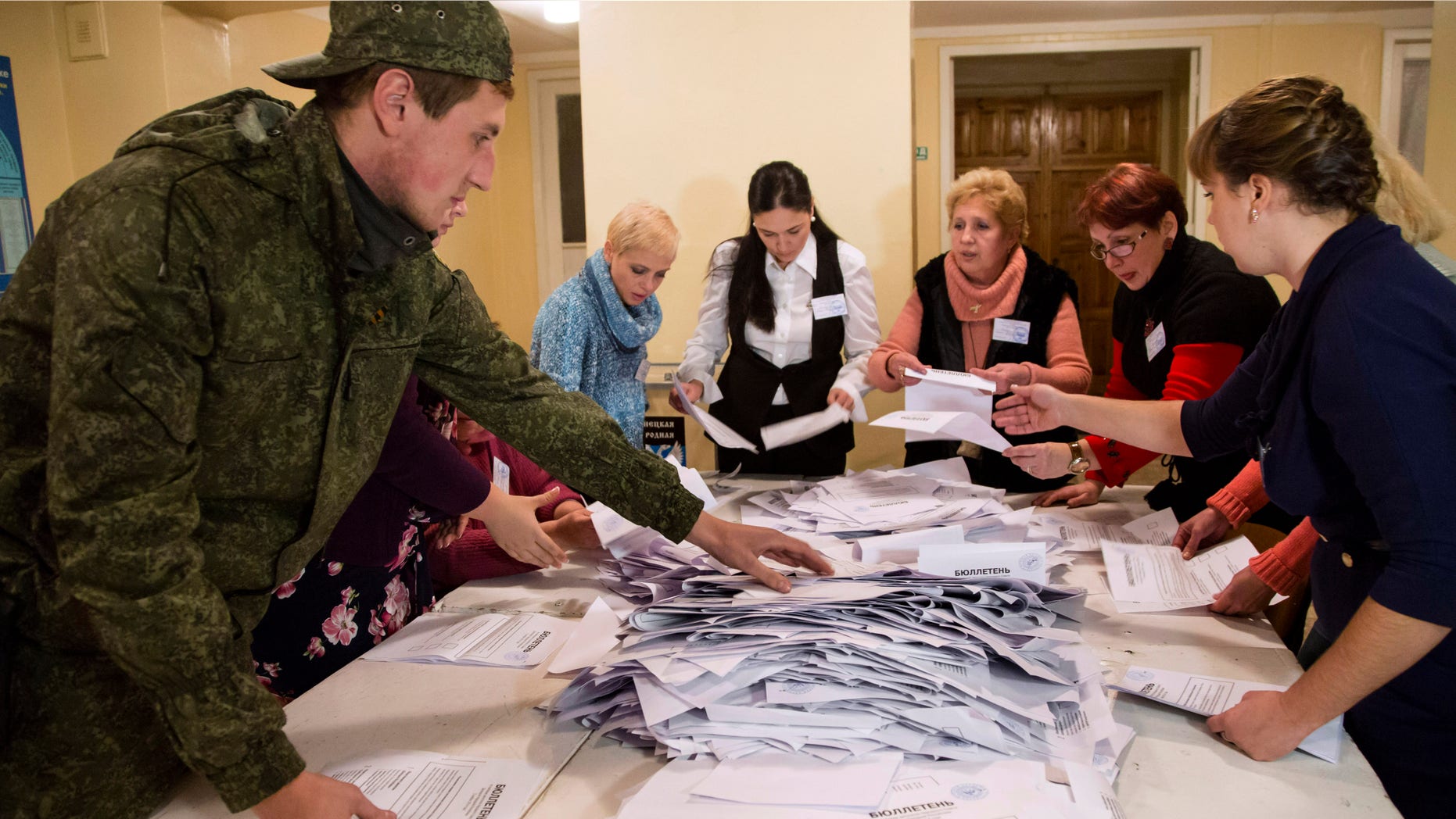 Nov. 2, 2014: Election officials count the votes during rebel elections at a polling station in the city of Donetsk, eastern Ukraine
