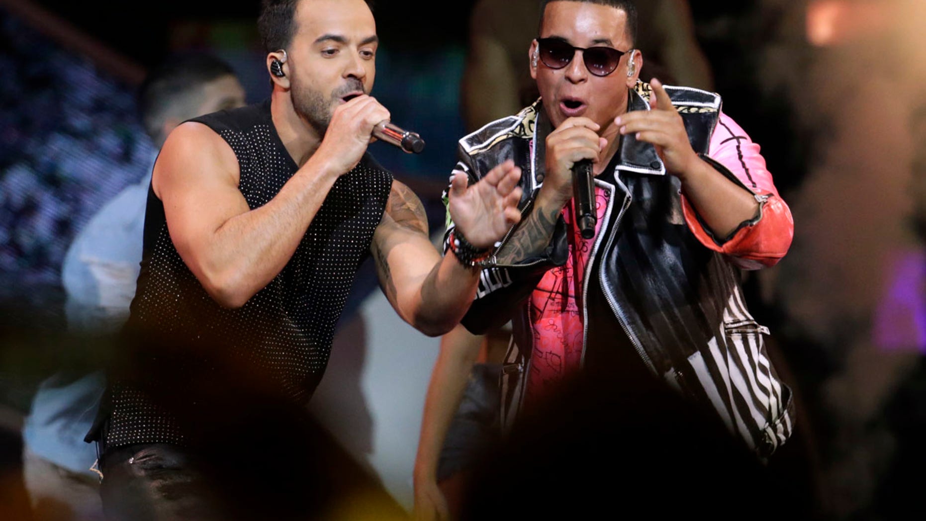 FILE 2017: Luis Fonsi, left and Daddy Yankee perform during the Latin Billboard Awards in Coral Gables, Fla.