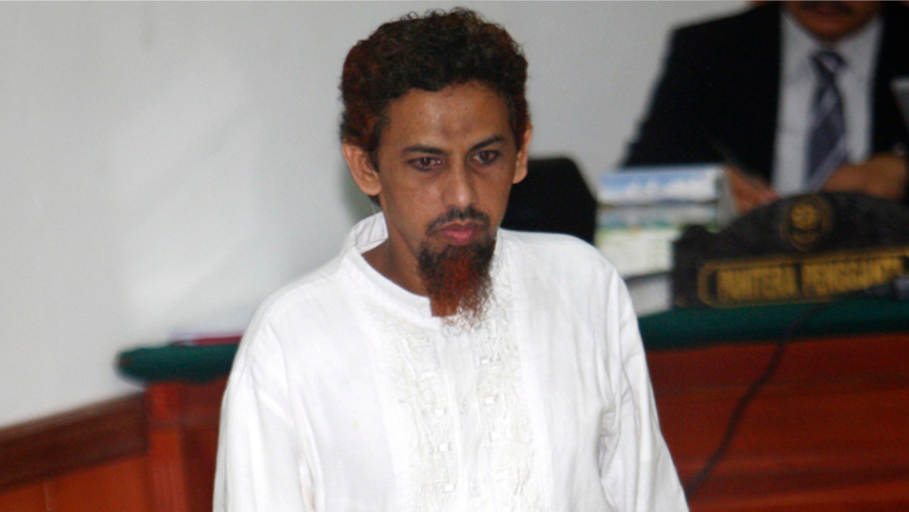 June 21, 2012: Indonesian militant Umar Patek enters the courtroom for his hearing at West Jakarta district court in Jakarta, Indonesia.