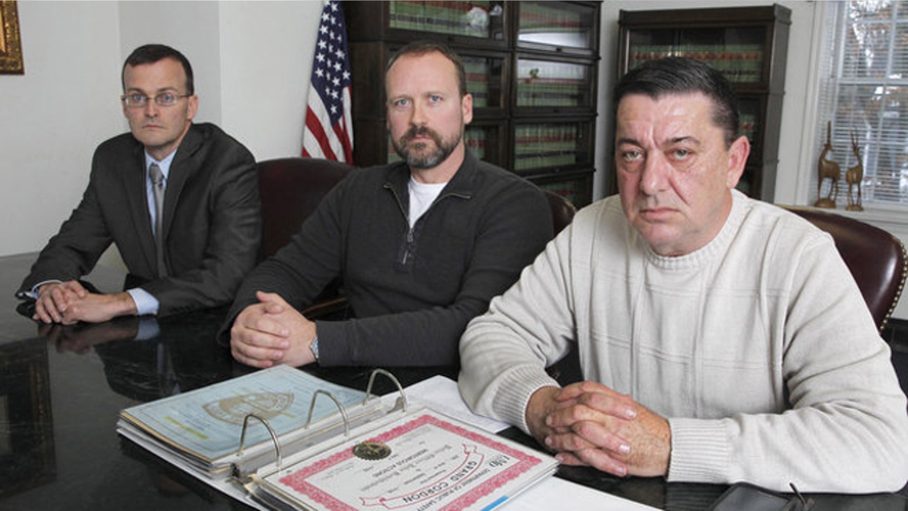 Attorney Thomas Roughneen,with clients, retired public university police officers Robert Dunsmuir and John Kotchkowski. (Jerry McCrea | For NJ Advance Media)