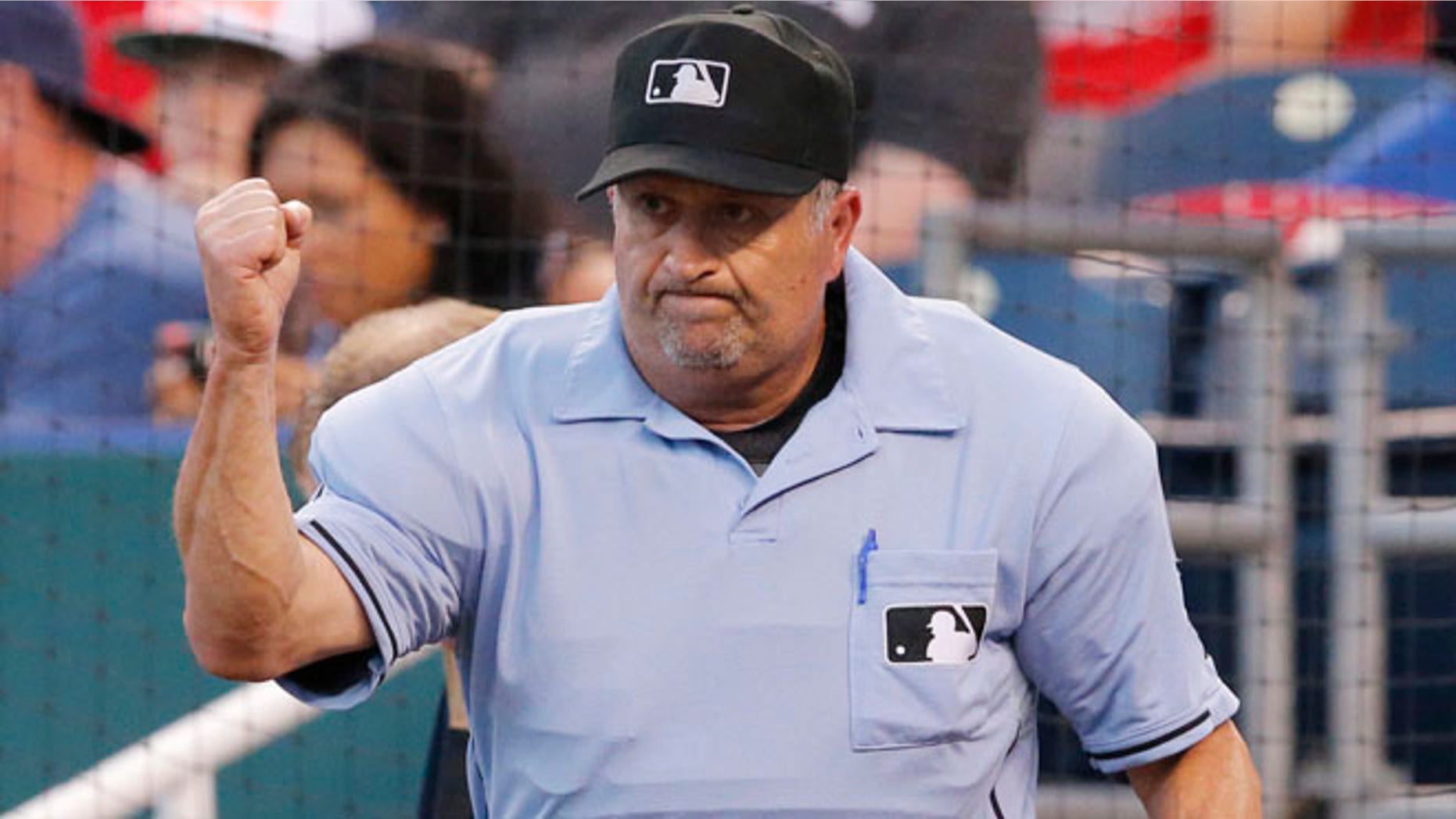 June 5, 2014: This photo shows umpire Dale Scott calling out St. Louis Cardinals' Yadier Molina after a play review in the fifth inning of a baseball game against the Kansas City Royals at Kauffman Stadium in Kansas City, Mo. (AP)