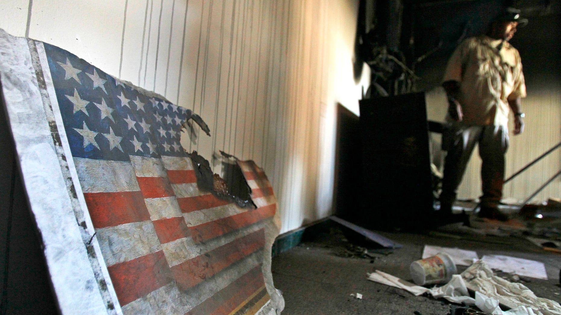 A US embassy broken flag during a visit for the press in the vandalized US Embassy in Tripoli, Libya, Monday, Sept. 12, 2011.