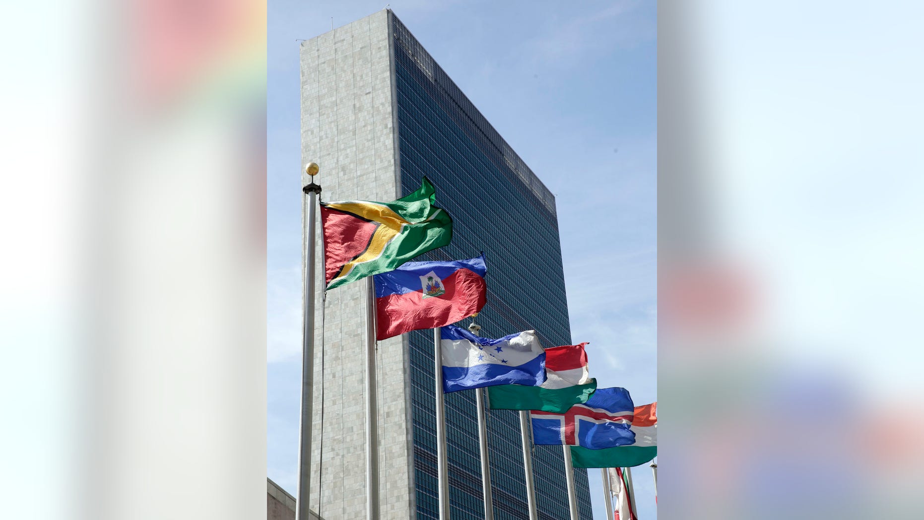 Flags of some of the 193 countries fly in the breeze outside the United Nations building in New York City.