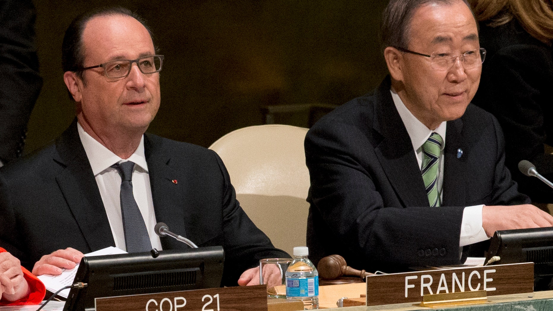 United Nations Secretary General Ban Ki-moon, right, and French President Francois Hollande attend the Paris Agreement on climate change ceremony, Friday, April 22, 2016 at U.N. headquarters. (AP Photo/Mary Altaffer)