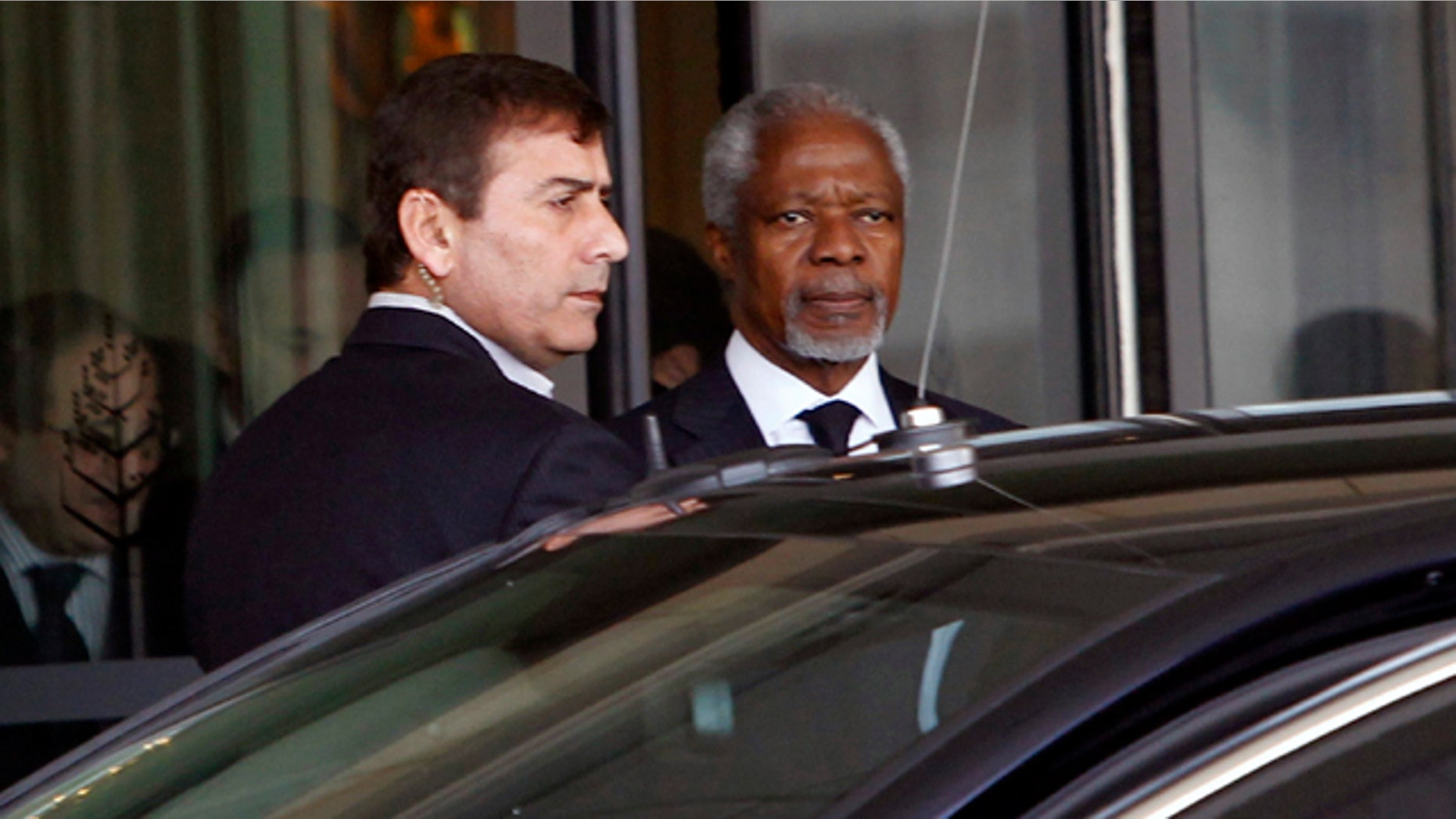 March 10, 2012: Kofi Annan, the United Nations special envoy to Syria, center, leaves the Four Seasons Hotel in Damascus, Syria on his way to the presidential palace for a meeting with Syrian President Bashar Assad.