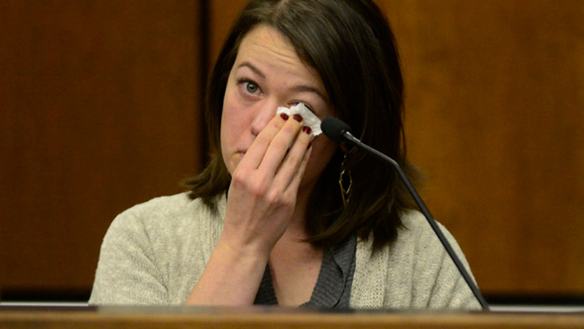 Michelle Wilkins reacts as she testifies in court. Wilkins, who had her baby cut from her womb by someone she just met, said she told herself she had to survive for the sake of her unborn daughter and tried to fight back.