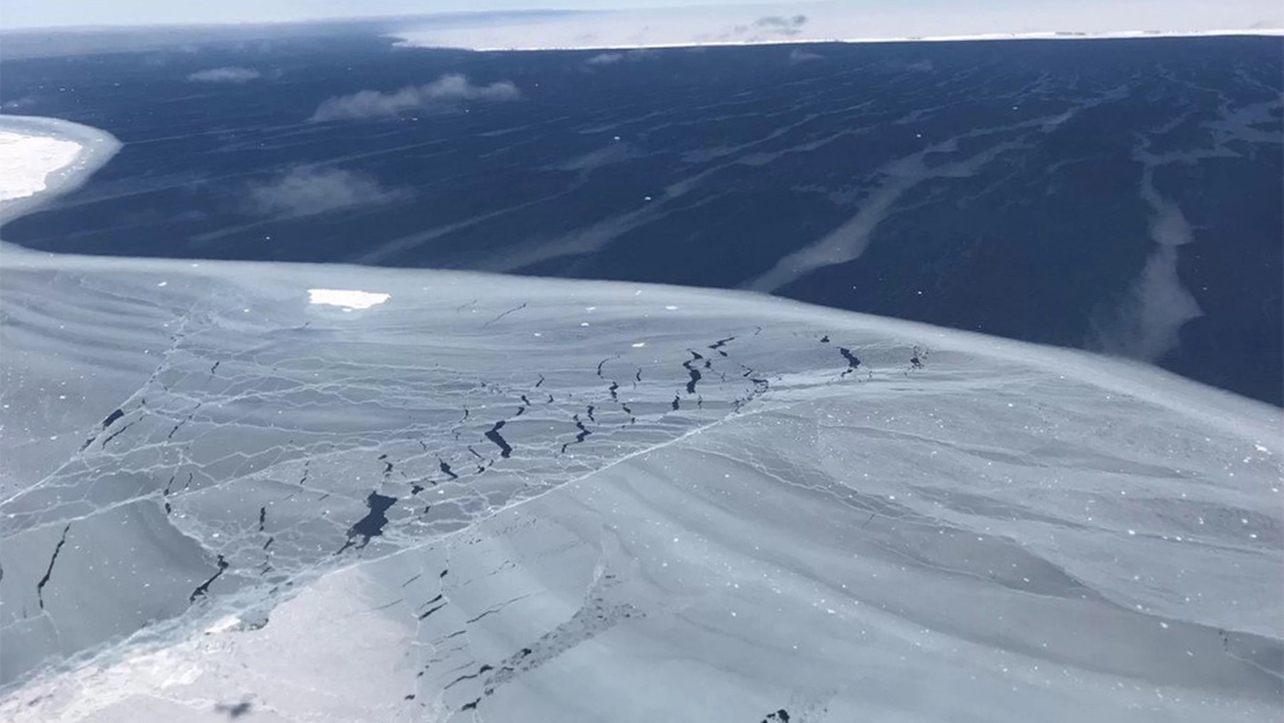 Looking out from the sea ice to iceberg A68, around November 2017, just months after the berg calved from Antarctica’s Larsen C Ice Shelf in July. (Credit: NASA)