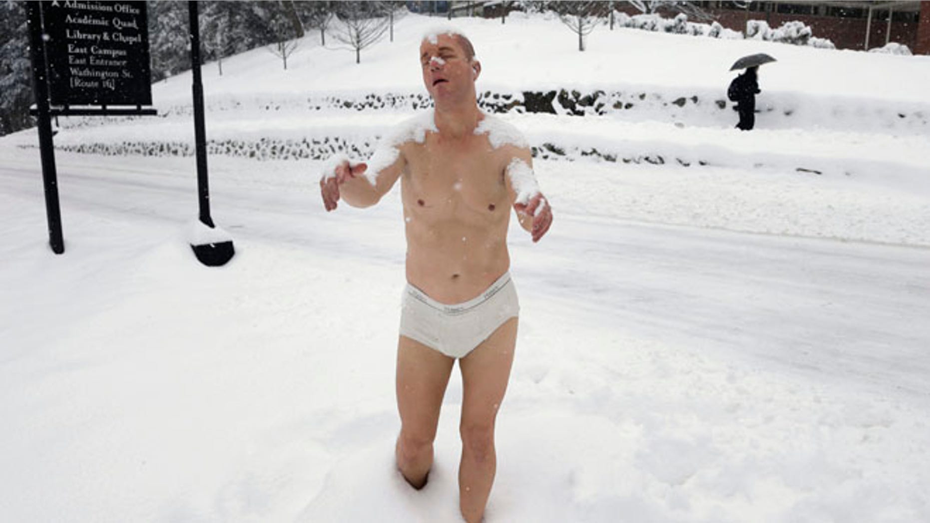 Feb. 5, 2014: A statue of a man sleepwalking in his underpants is surrounded by snow on the campus of Wellesley College, in Wellesley, Mass.