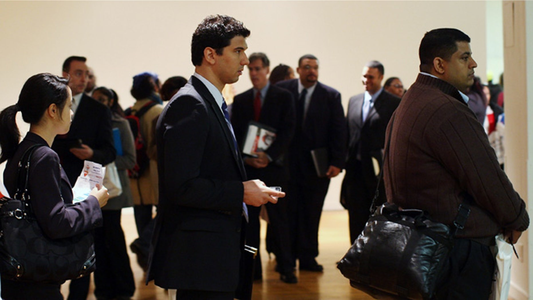 NEW YORK - APRIL 02: People wait on line to speak with job recruiters on at the New York City Career Fair April 2, 2009 in New York City. Hundreds of people dropped off resumes, attended seminars and spoke with employers from a broad selection of careers in the hope of gaining employment. As the global economic downturn continues, the U.S. rate of unemployment rose from 7.6 percent in January to 8.1 percent in February while newly released U.S. claims for state unemployment benefits jumped last week to a 26-year high. (Photo by Spencer Platt/Getty Images)