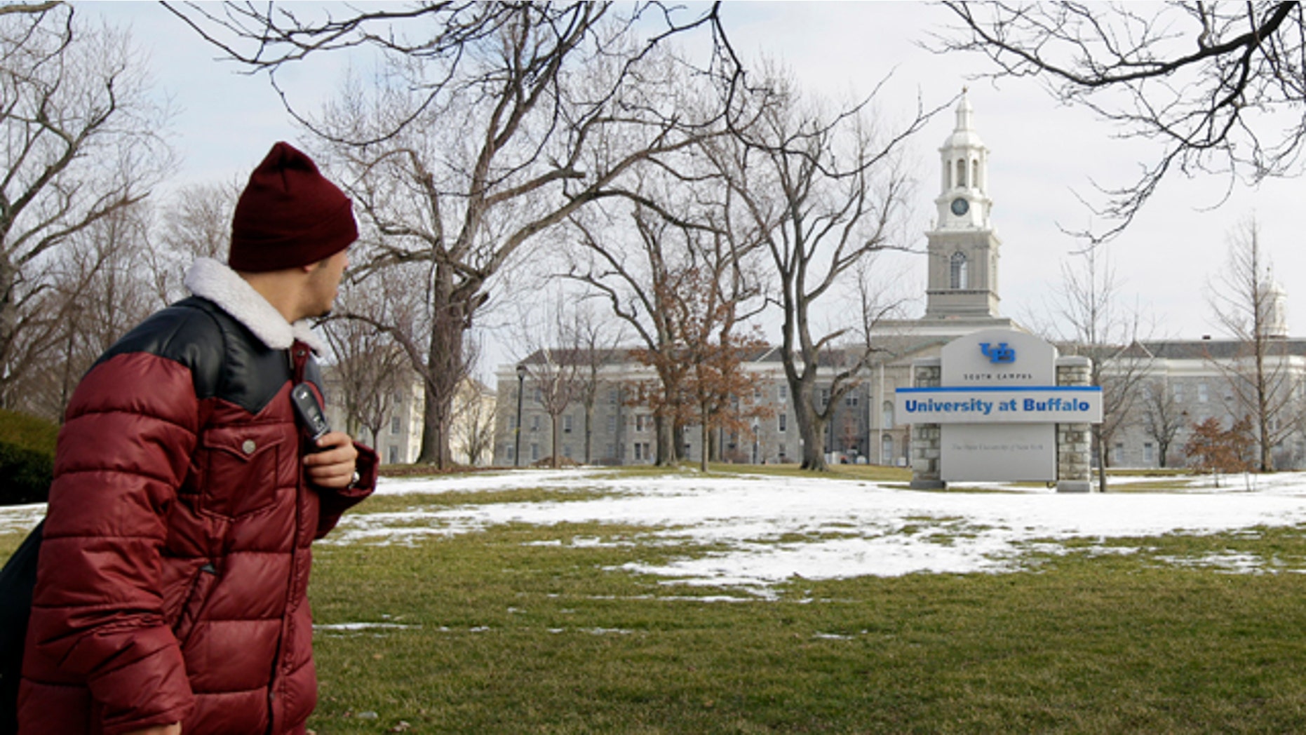 Feb. 15, 2012: A person walks on the University at Buffalo campus in Buffalo, N.Y. The New York Police Department monitored Muslim college students far more broadly than previously known, at schools far beyond the city limits, including the University at Buffalo, the Ivy League colleges of Yale and the University of Pennsylvania, The Associated Press has learned.