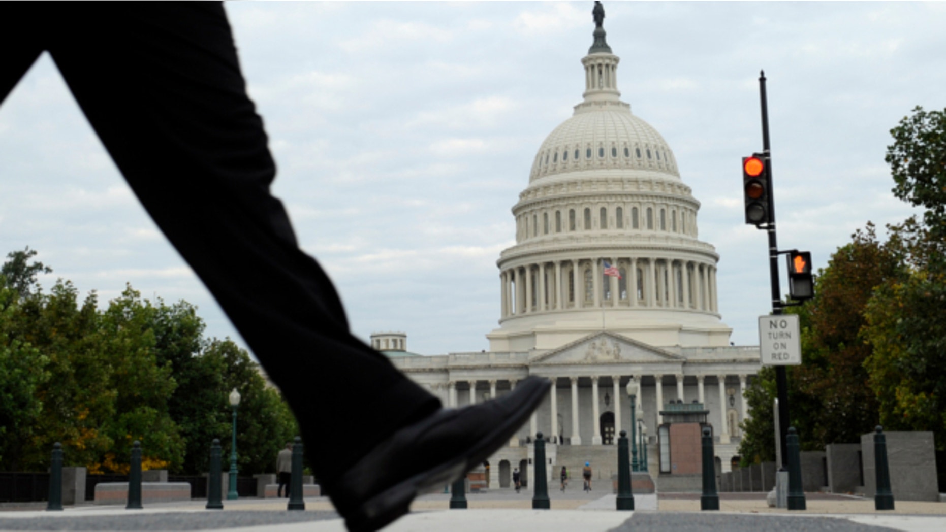Oct. 1, 2013: People walk near Capitol Hill in Washington as the government’s slimdown enters a second day.