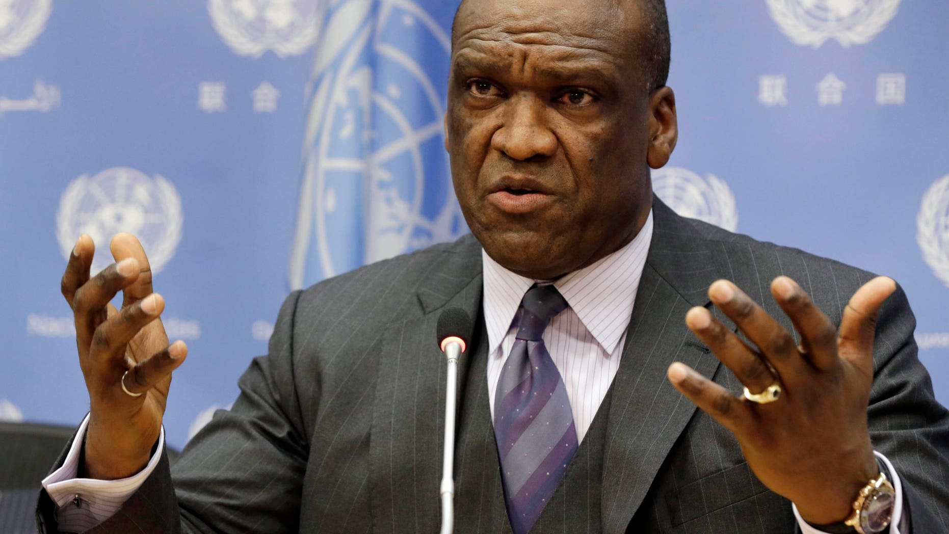 FILE - Sept. 17, 2013: Ambassador John Ashe, of Antigua and Barbuda, the president of the General Assembly's 68th session, speaks during a news conference at United Nations headquarters. Ashe accepted more than $500,000 in bribes from a Chinese real estate mogul and other businesspeople in exchange for help obtaining lucrative investments and government contracts, according to federal court documents unsealed Tuesday, Oct. 6, 2015.