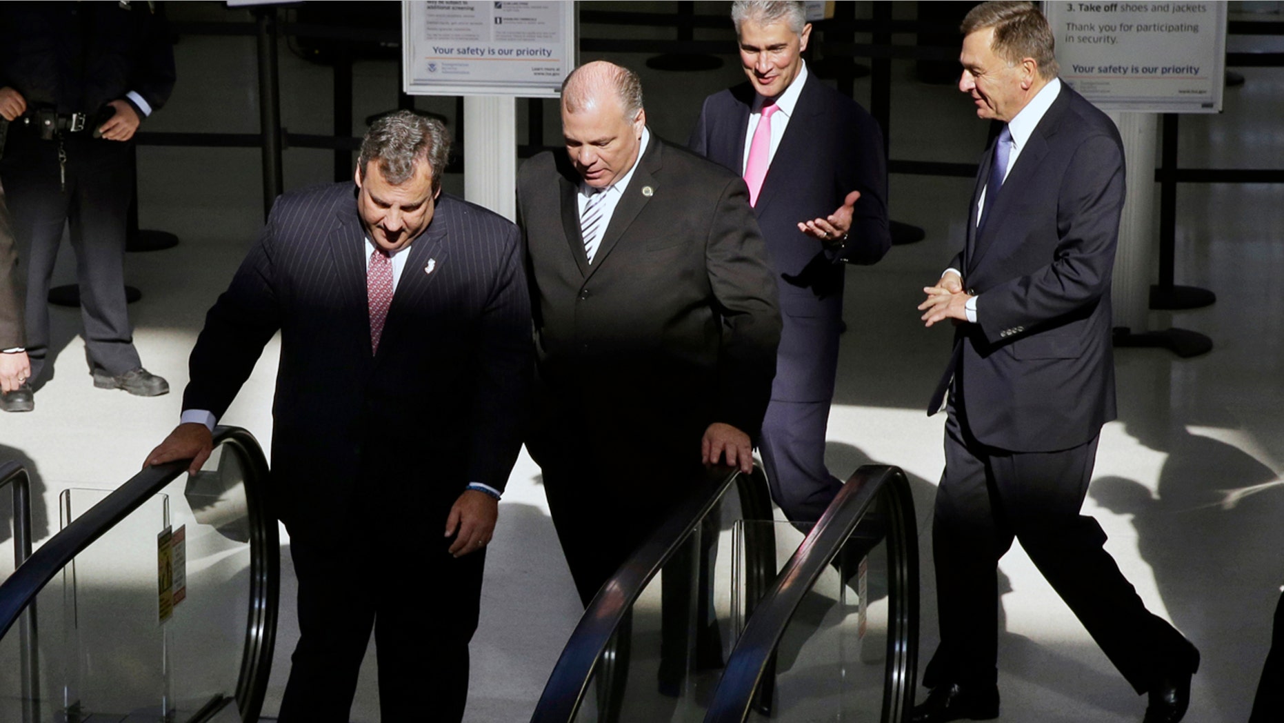 Nov. 14, 2013: New Jersey Gov. Chris Christie, left, New Jersey Senate President Steve Sweeney, second left, United Airlines CEO Jeff Smisek, third left, and New York/New Jersey Port Authority Chairman David Samson, fourth left, walk together at Newark Liberty International Airport, in Newark, N.J.