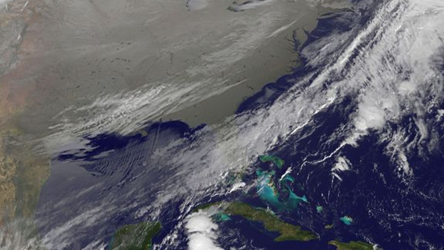 In this image, captured in infrared light by the National Oceanic and Atmospheric Agency's GOES-East satellite on Nov. 18, 2014, the cold air over the central and eastern U.S. looks like a gray-white blanket.