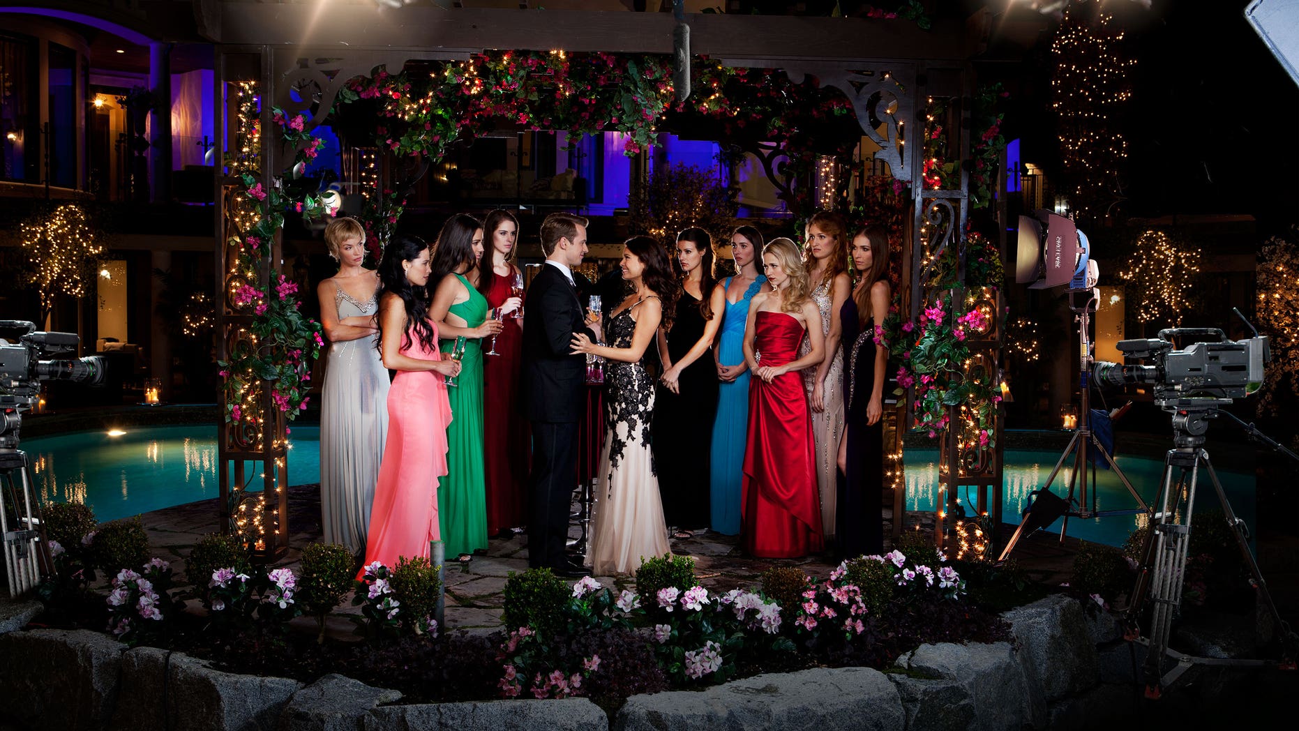 The cast of "UnREAL" poses in a scene from the series, airing on Lifetime on Mondays.